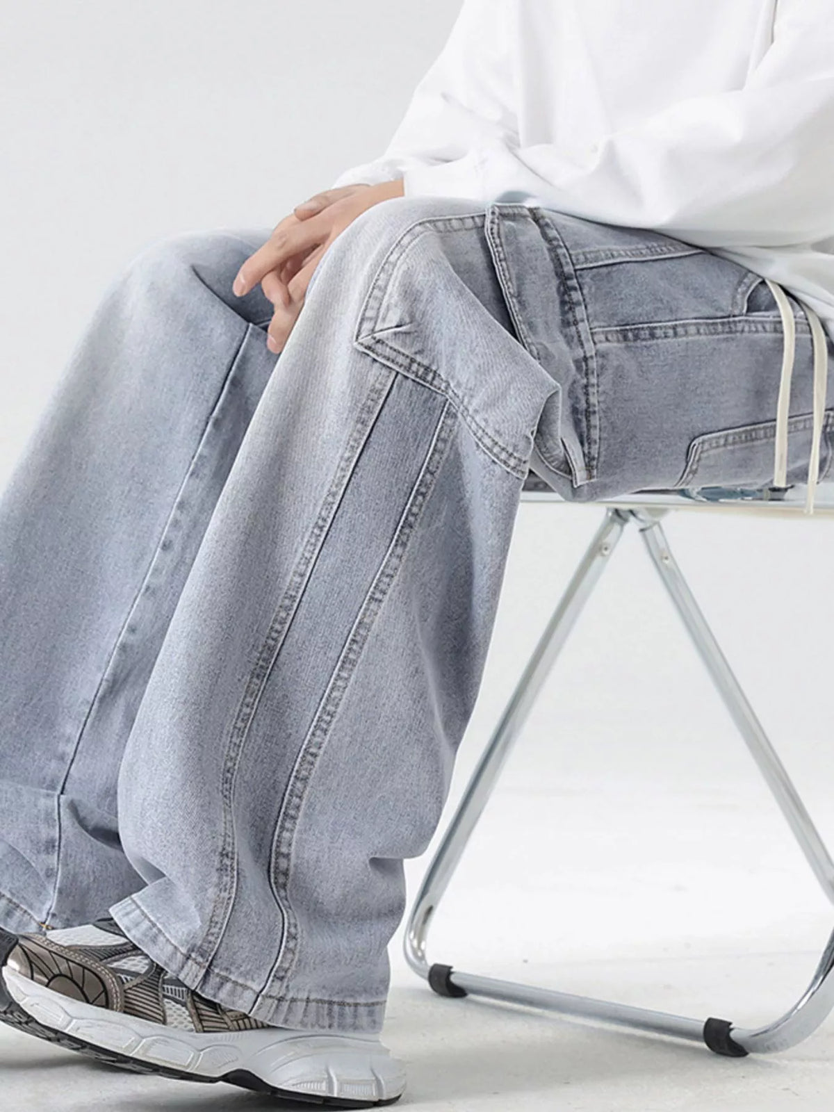 Washed light gray wide-leg cargo jeans with patch pocket and white drawcord waist ties