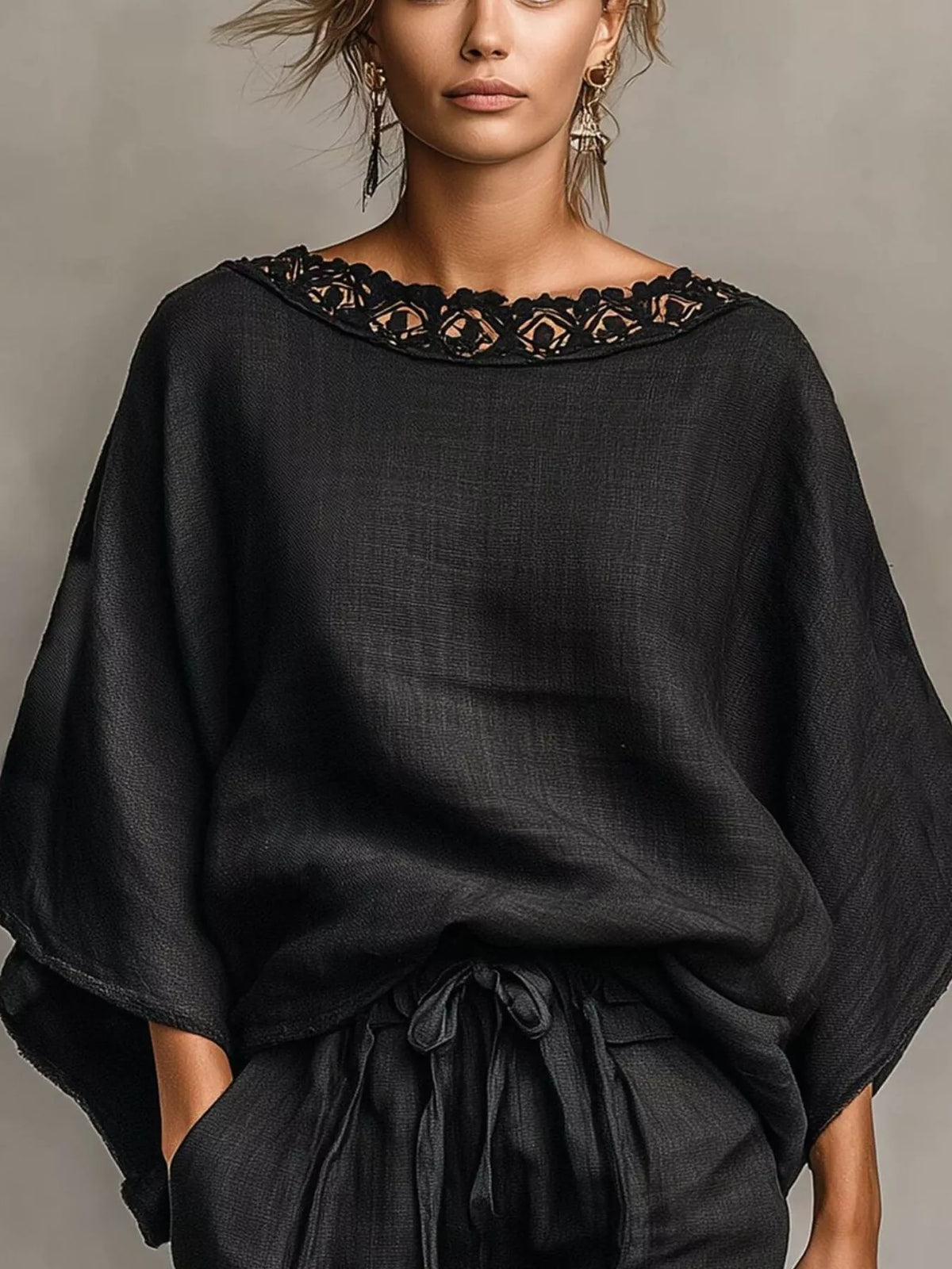 Black oversized lace-trim neckline top and matching drawstring shorts, close portrait