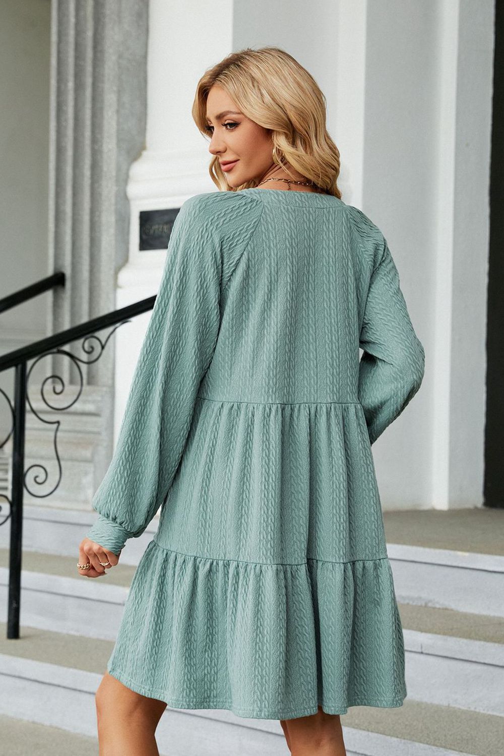 Light green notched-neck long-sleeve mini dress, back view with tiered hem