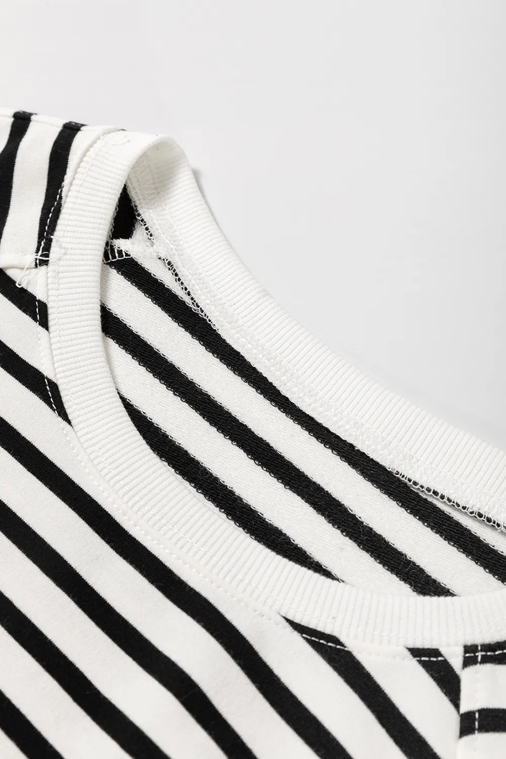Black-and-cream striped crewneck sweatshirt collar with ribbed neckline
