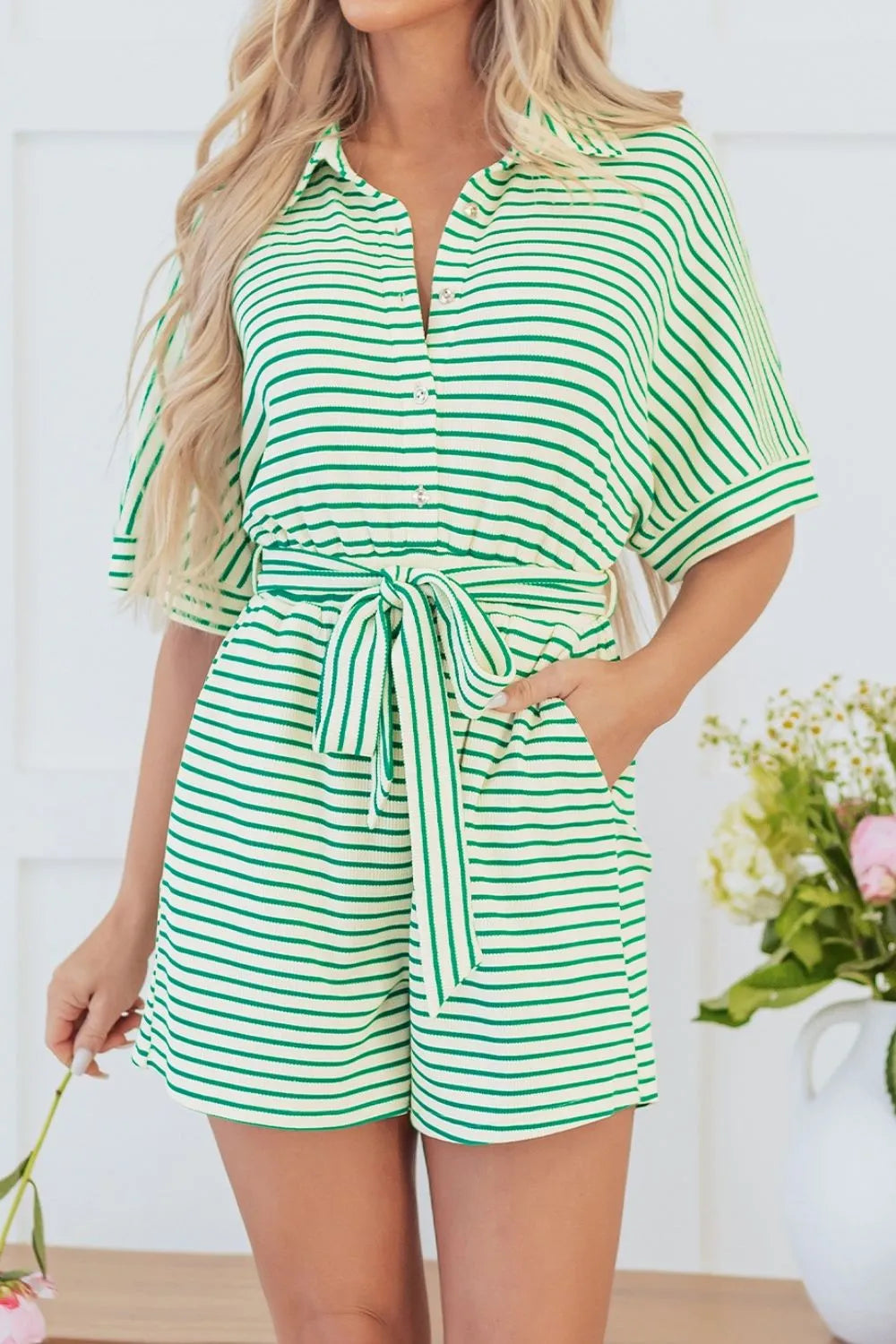 Green and white striped romper with half sleeves and front tie waist