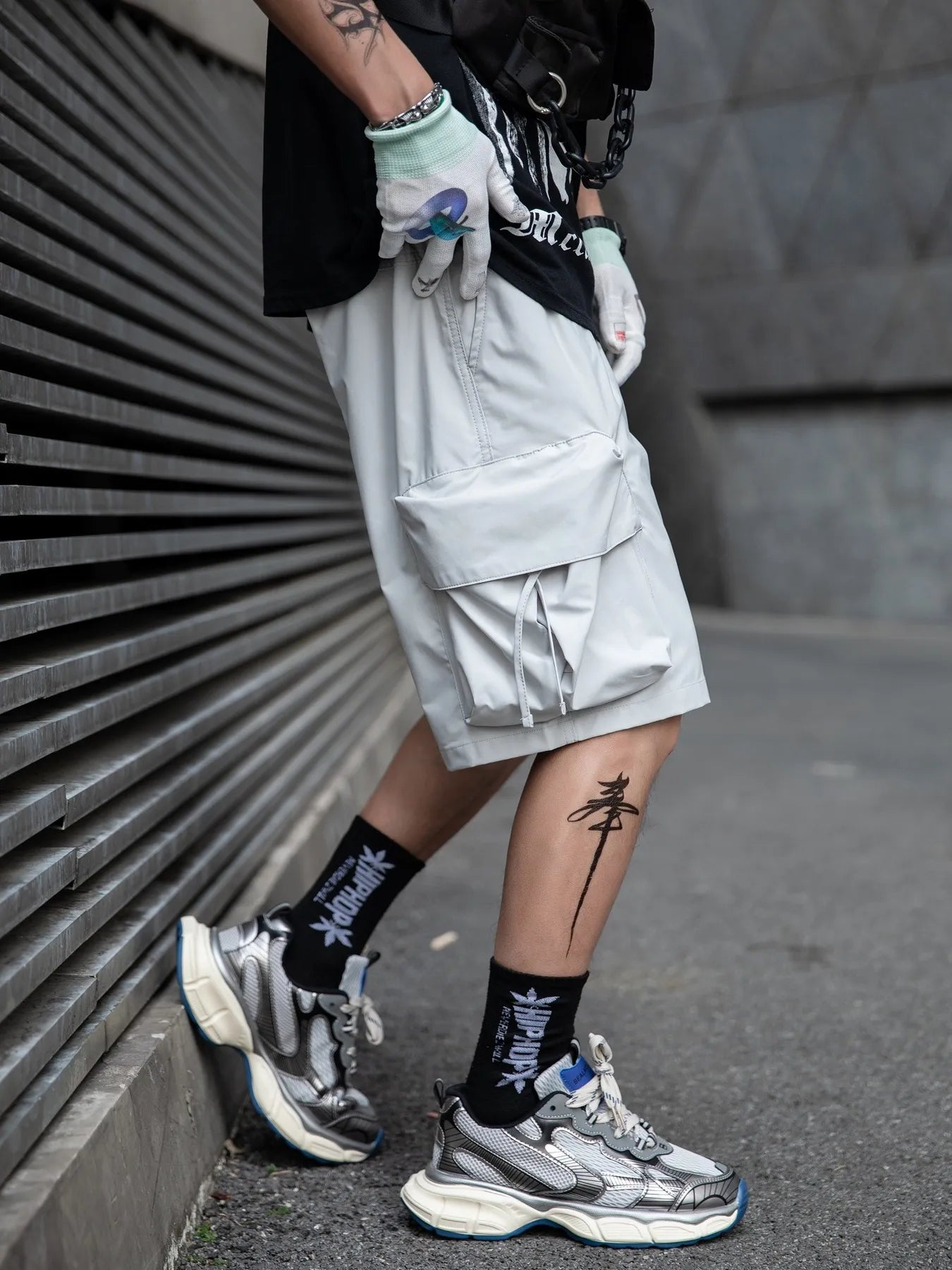 Light grey cargo shorts with utility cargo pockets and elastic drawstring waist