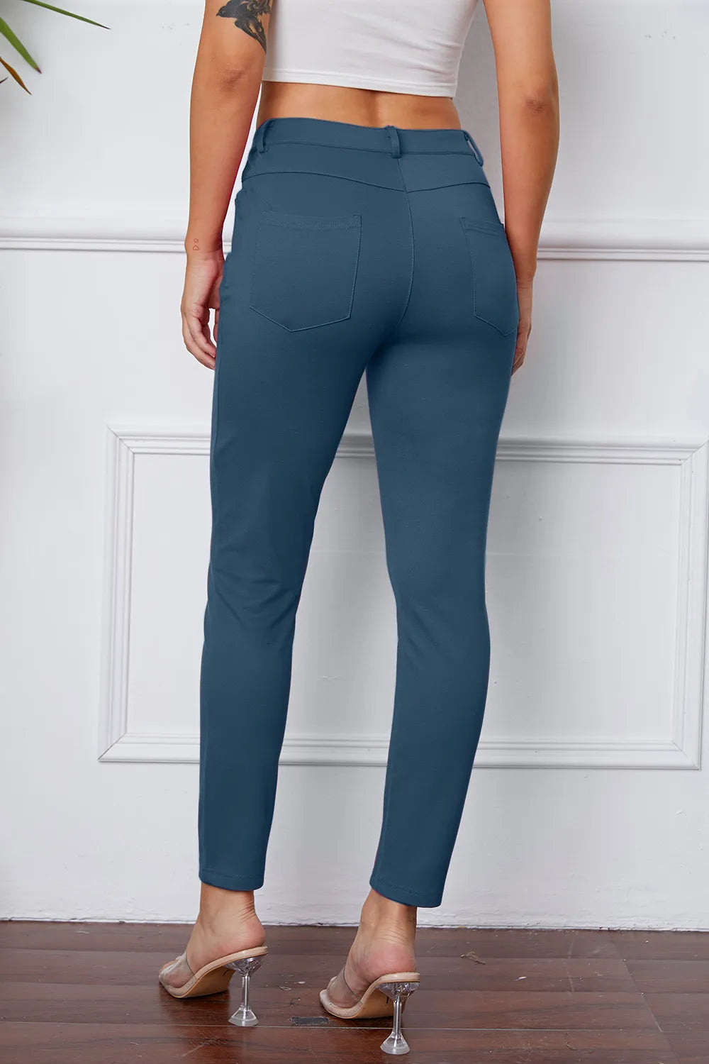 StretchyStitch pants, dark blue, back view with button closure and slim ankle fit