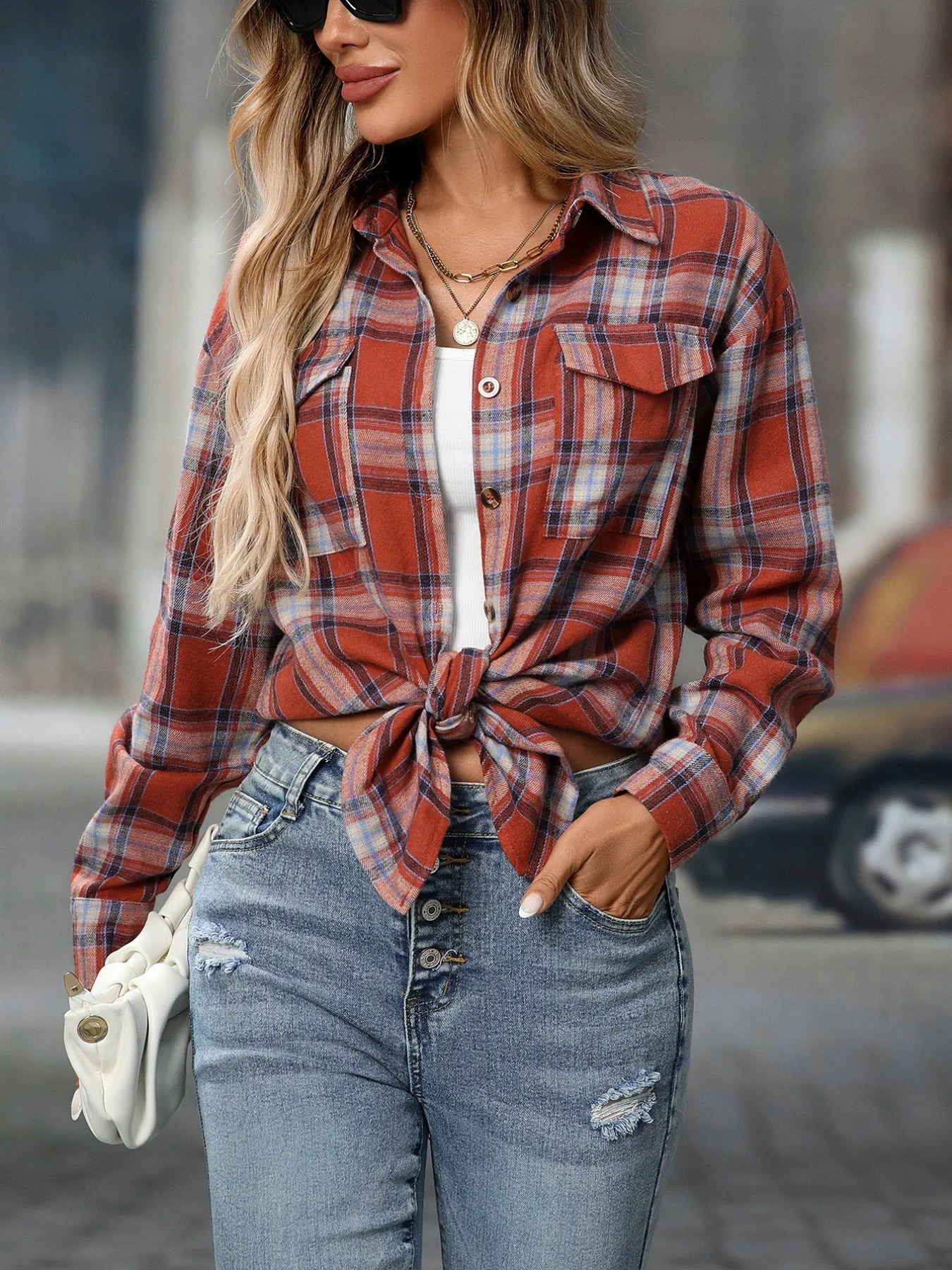 Plaid button-down oversized shirt in rust orange with blue and cream plaid, chest pockets
