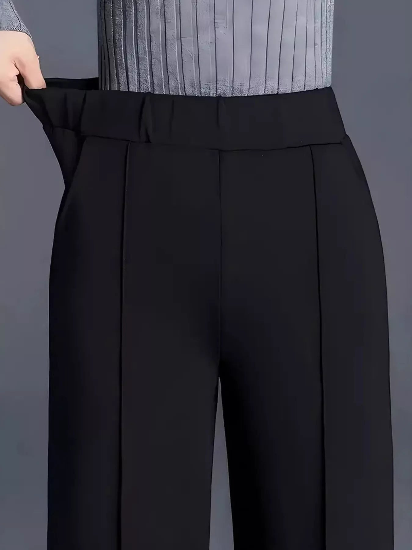 High-waisted wide-leg pants in black, flat front with wide leg opening and clean waistband