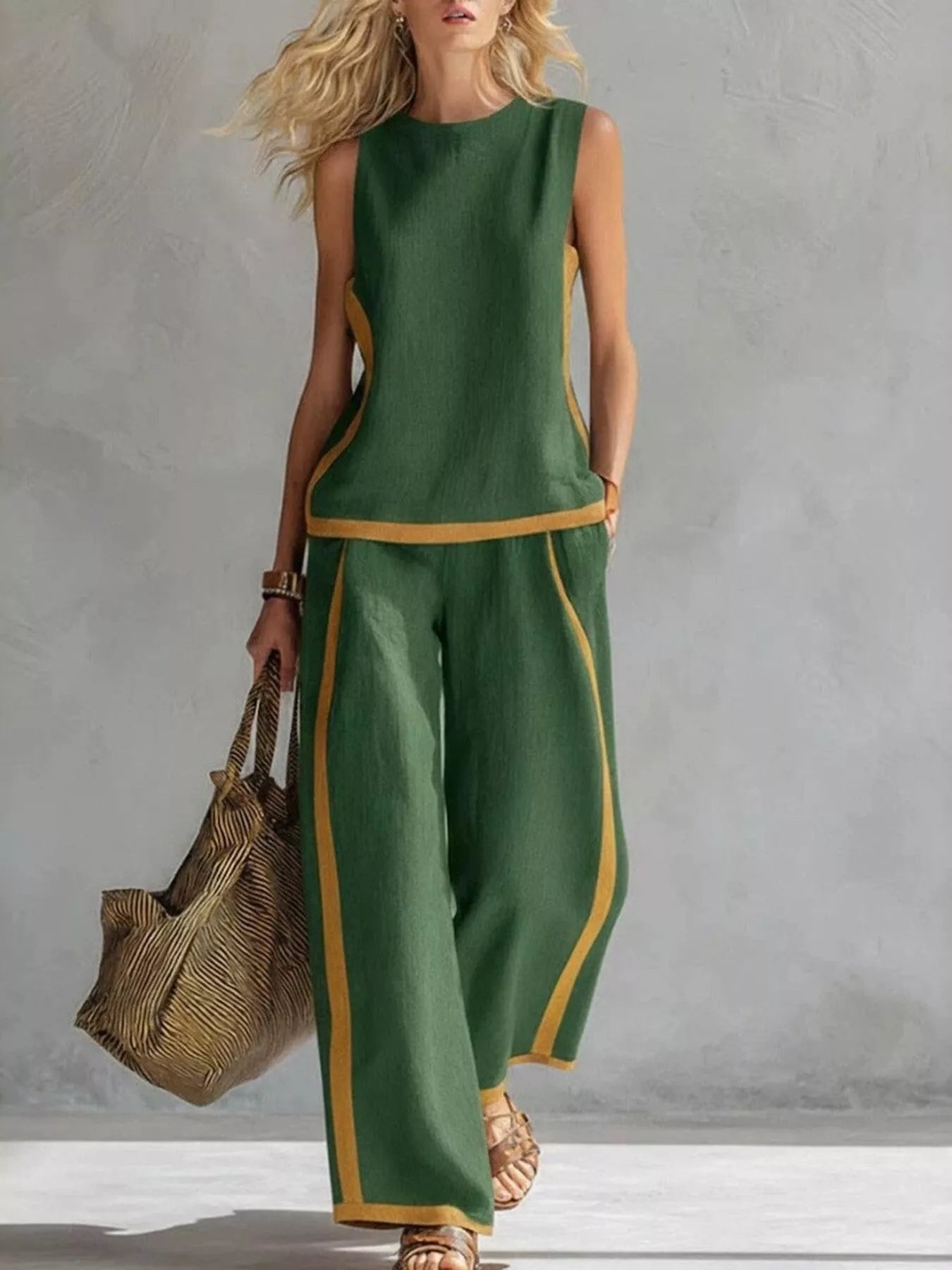 Green sleeveless top and wide-leg pants set with gold contrast trim