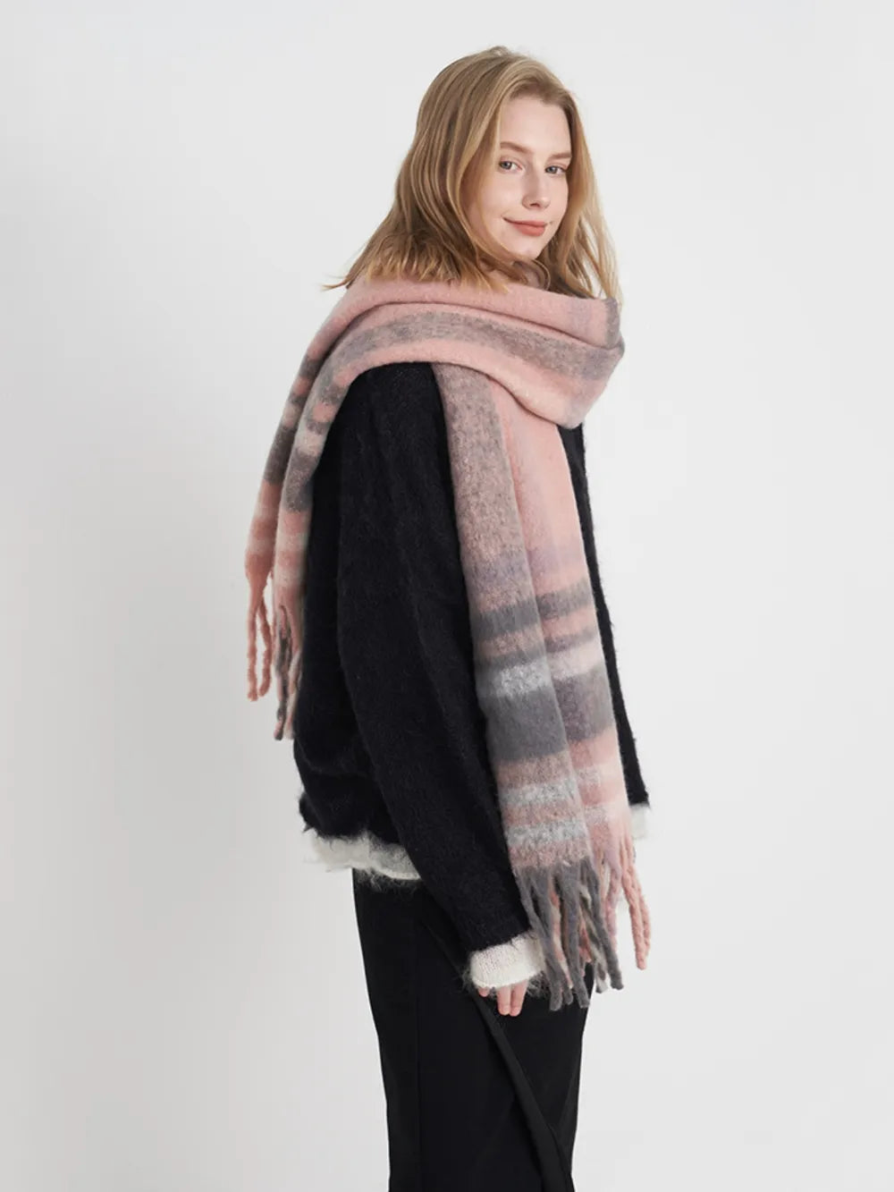 Plaid polyester scarf in pink and gray with soft fringe trim.
