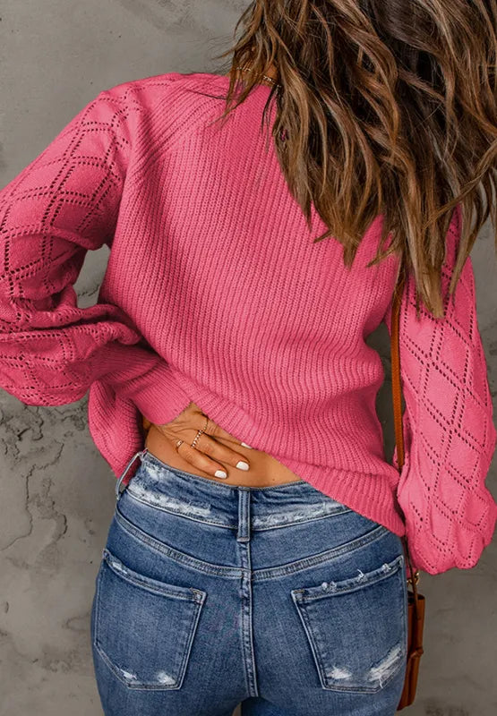 Hot pink openwork cardigan with textured knit sleeves on model