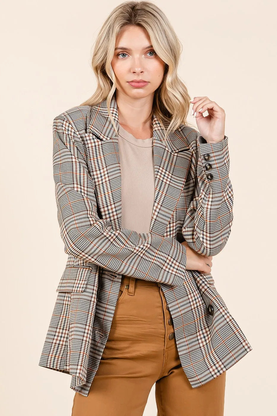 Brown plaid double-breasted blazer with notch lapels and two rows of buttons