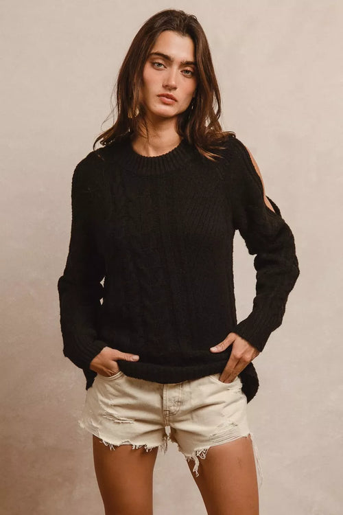 Black twist-knit sweater with long sleeves and ribbed hem