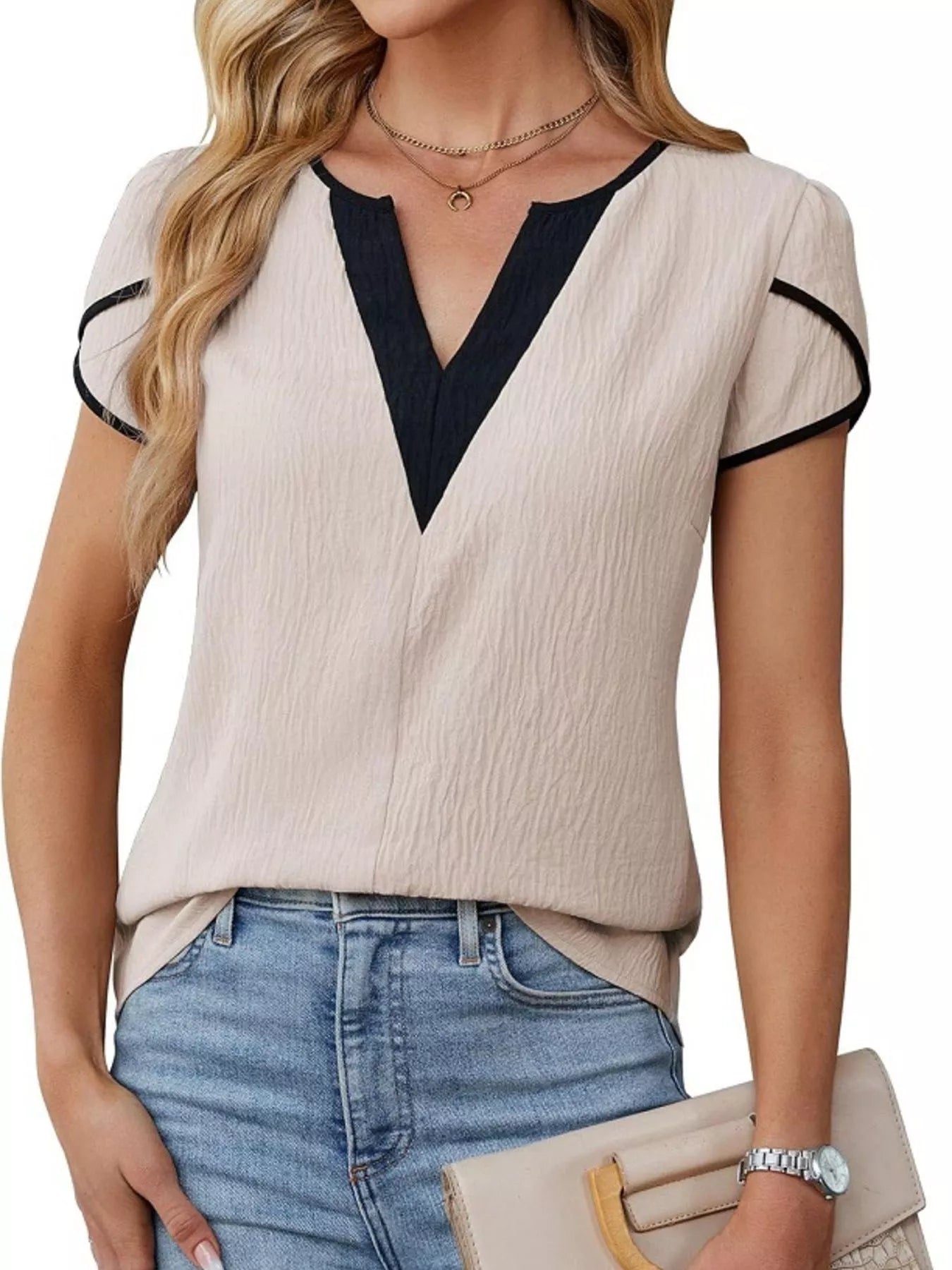 Notched Petal Sleeve Blouse in cream with black V-neck panel and black-trim short sleeves