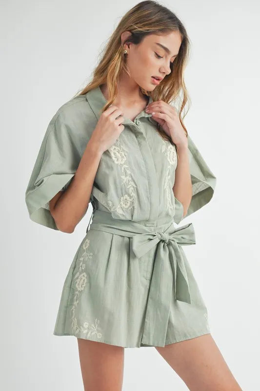 Dusty sage collared button romper with embroidered chest and waist tie