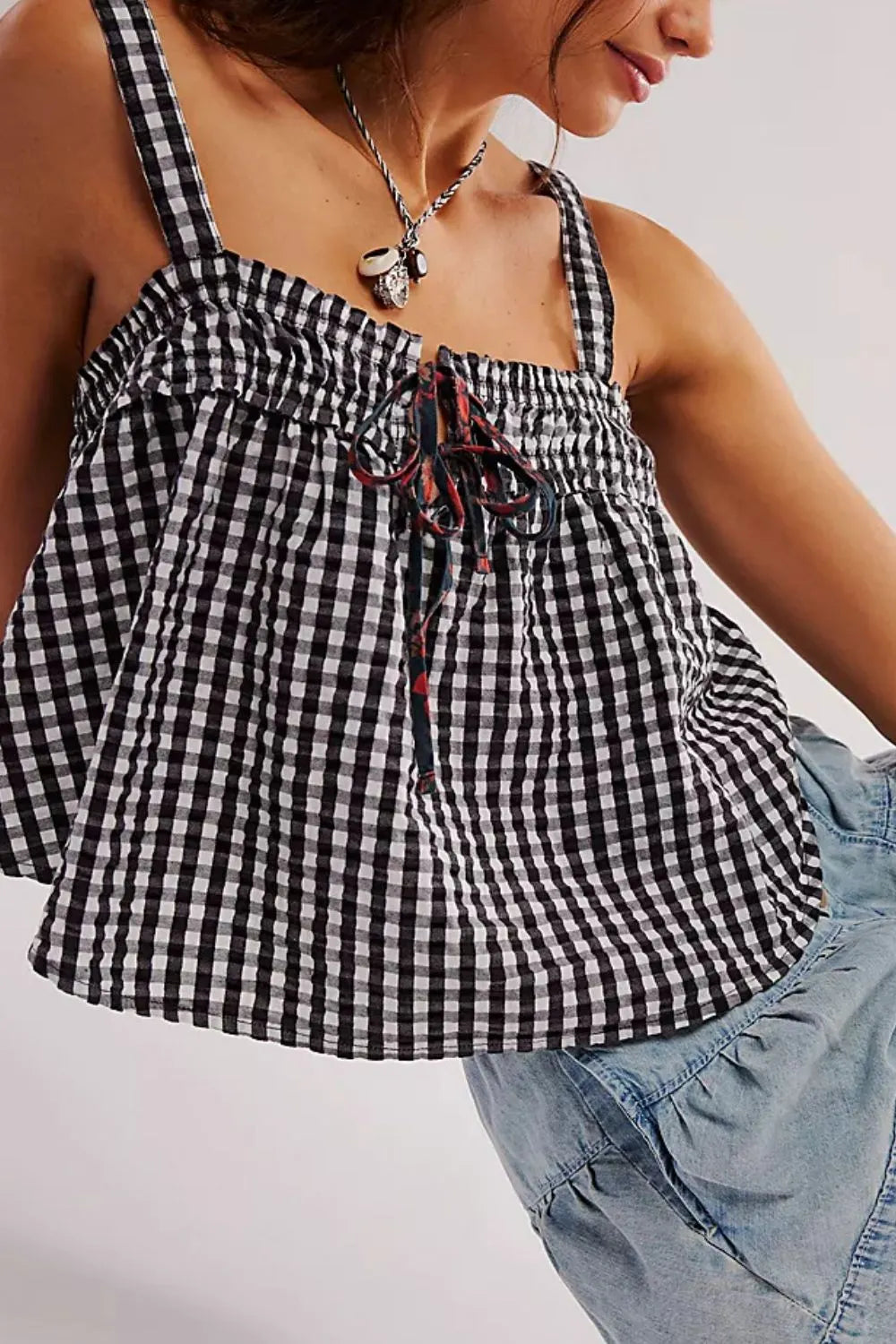 Black gingham cami with ruched neckline and tie-front bow detail