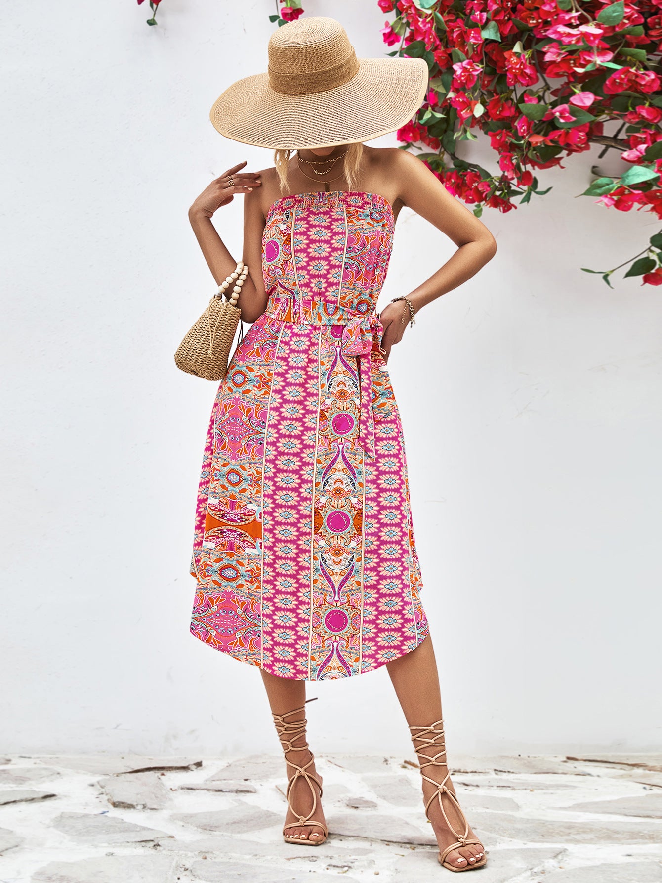 Hot pink strapless tie-belt dress with detailed geometric print and waist tie, midi length