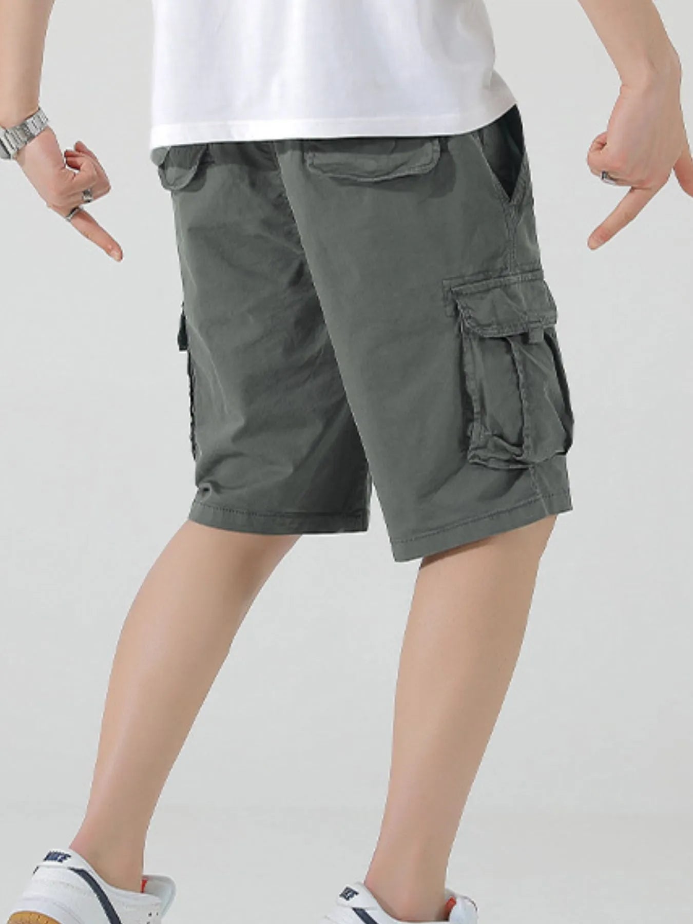 Olive drawstring cargo shorts with flap cargo pocket at thigh and side seam pockets
