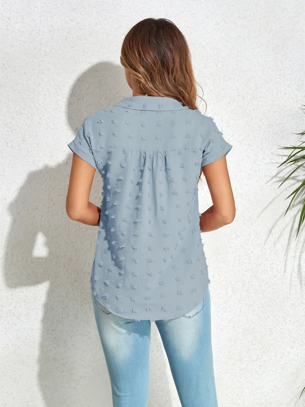 Light blue Swiss-dot cap-sleeve button-up shirt, back view