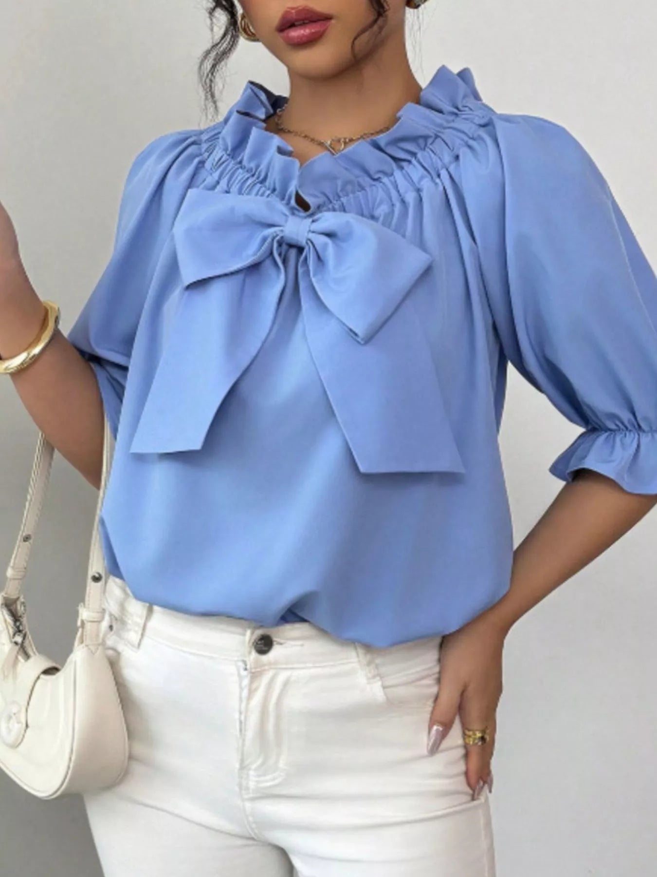 Bow Flounce Sleeve Blouse in light blue with a large bow and ruffled neckline by Trendsi