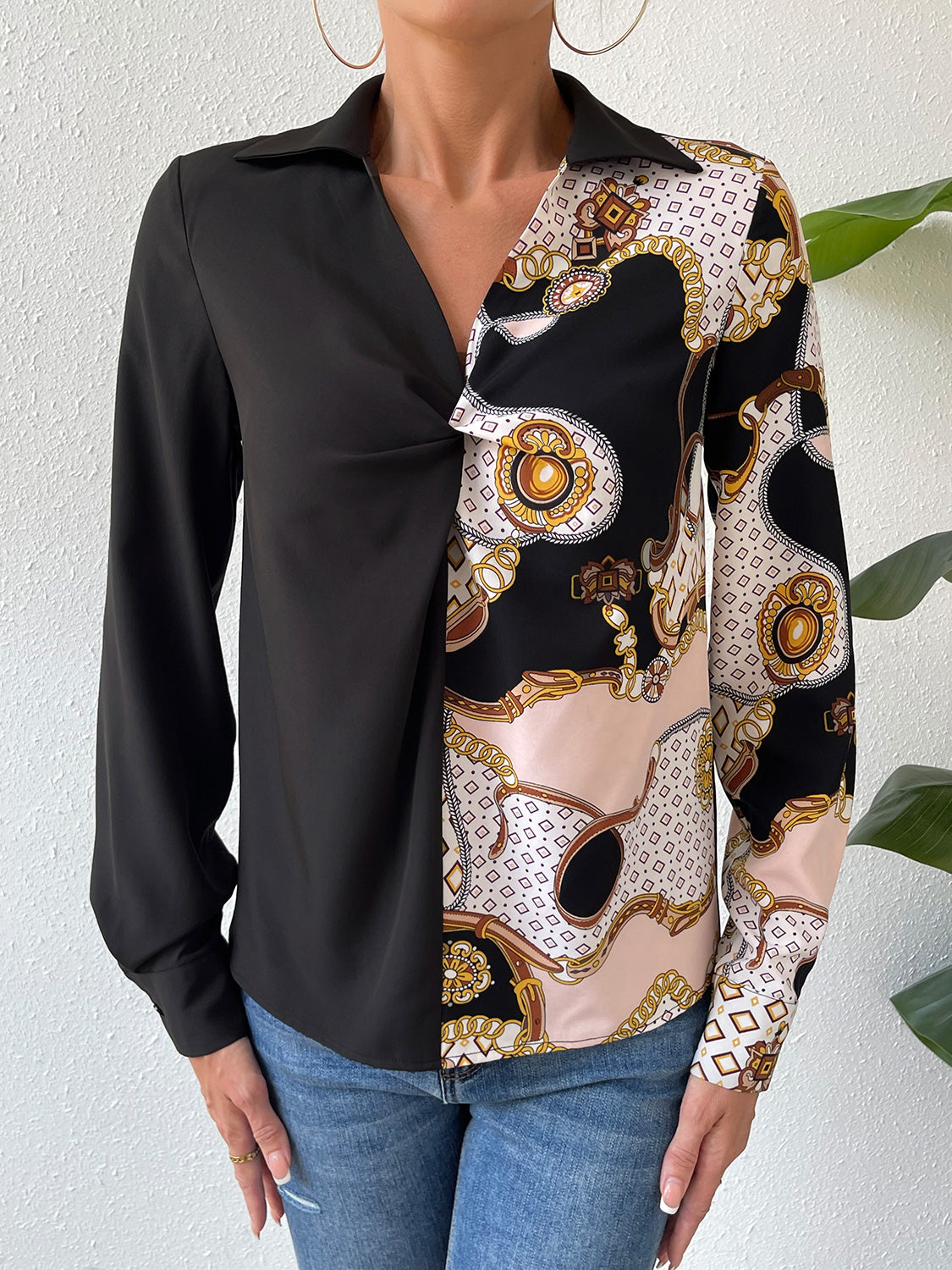 Black twist-front collared blouse with long sleeve and ornate patterned front panel