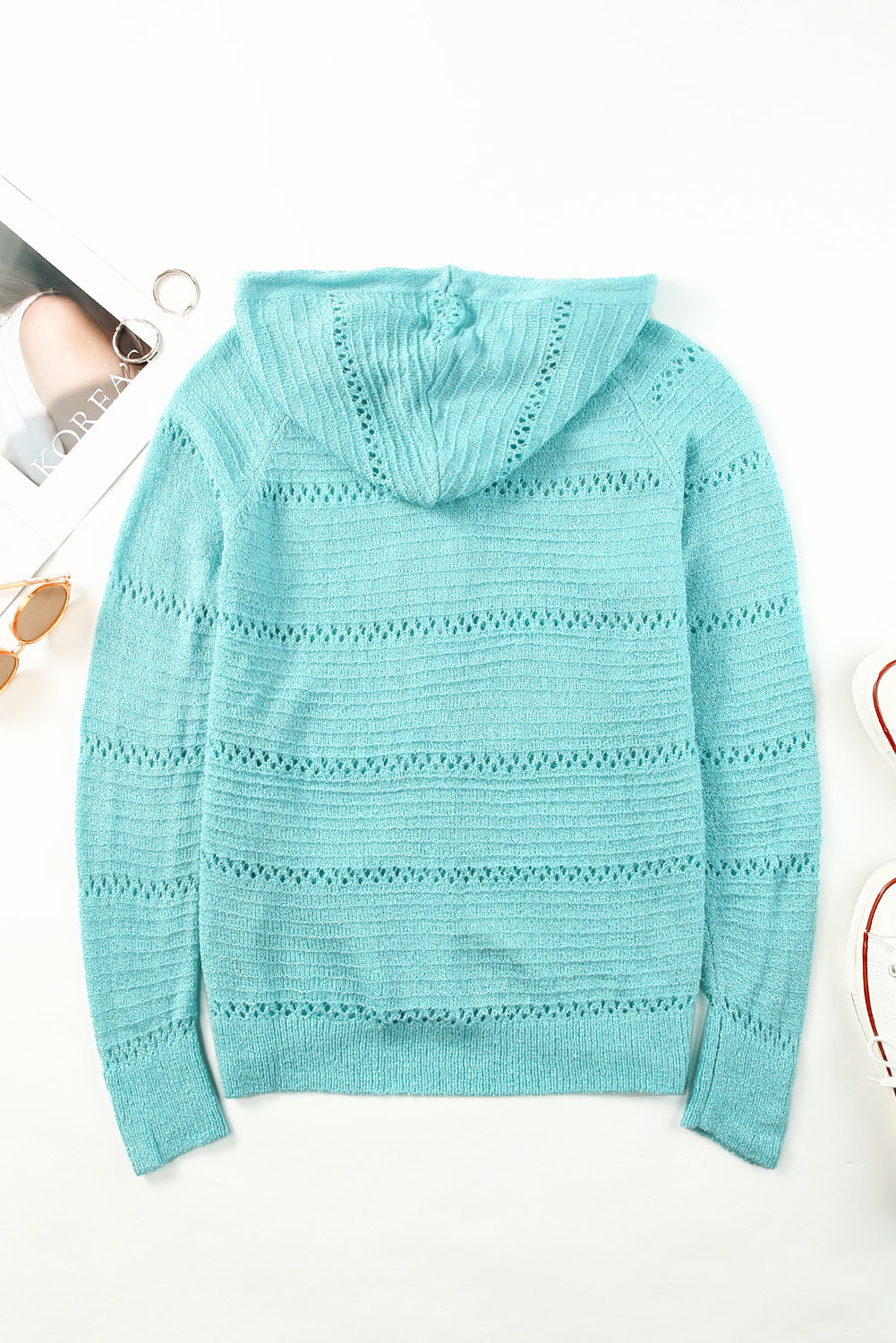 Turquoise openwork hooded cardigan with knit stripes and ribbed waistband