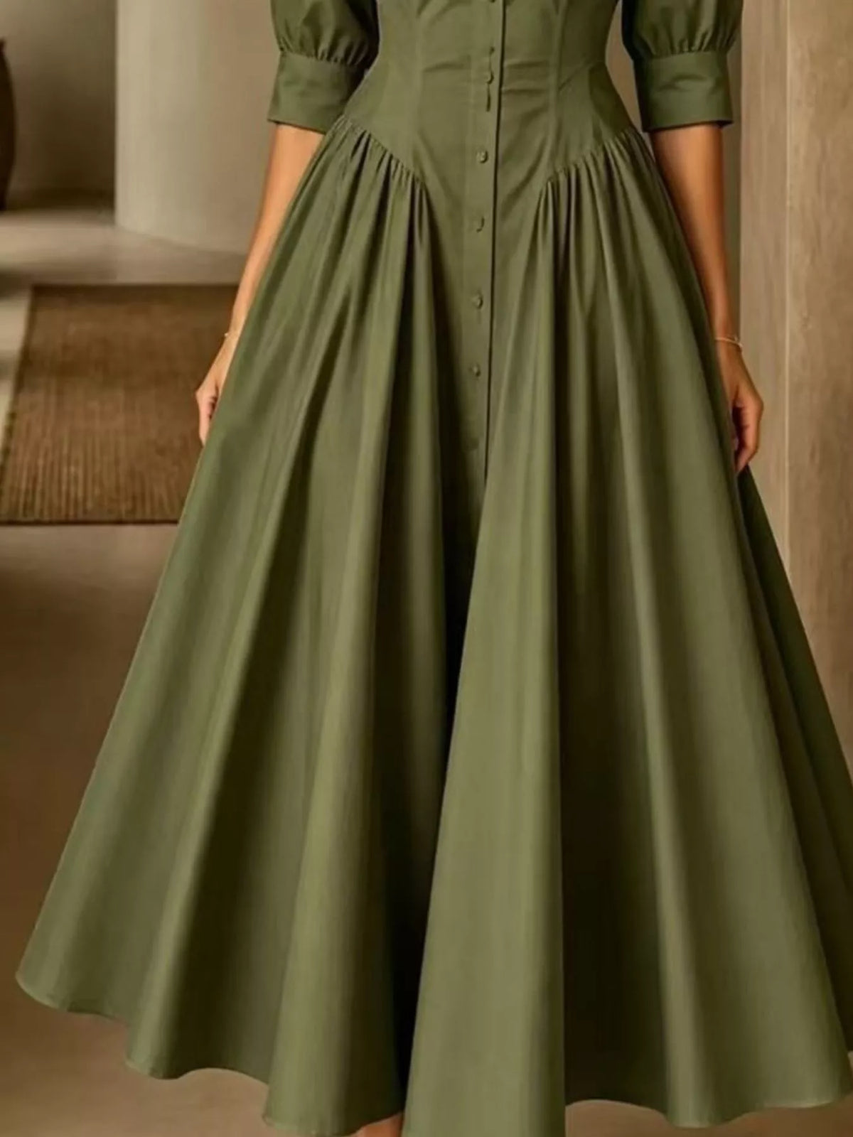 Army green button-down shirt dress hem detail with flared, gathered skirt