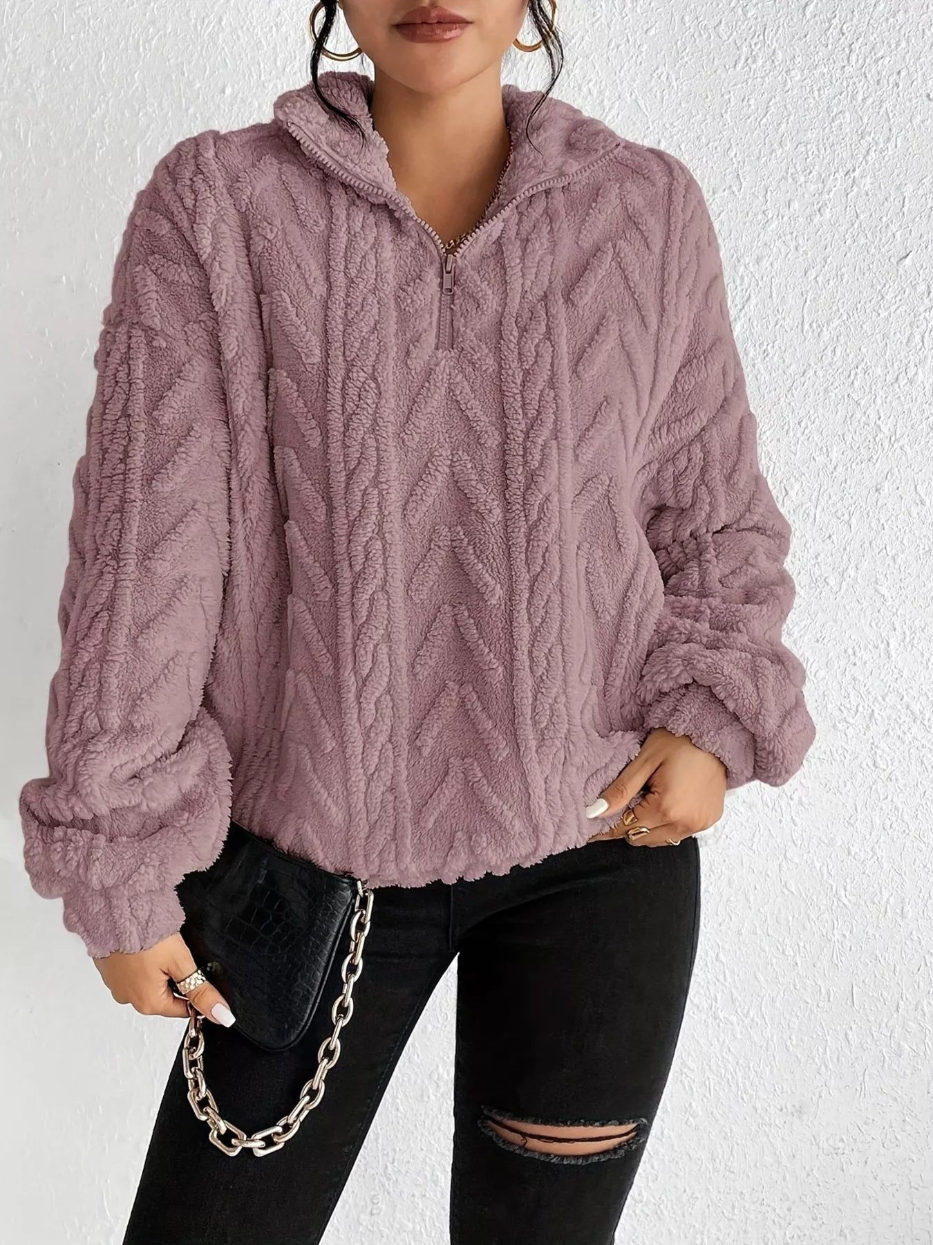 Light purple sherpa quarter-zip sweatshirt with cable knit pattern and dropped shoulders