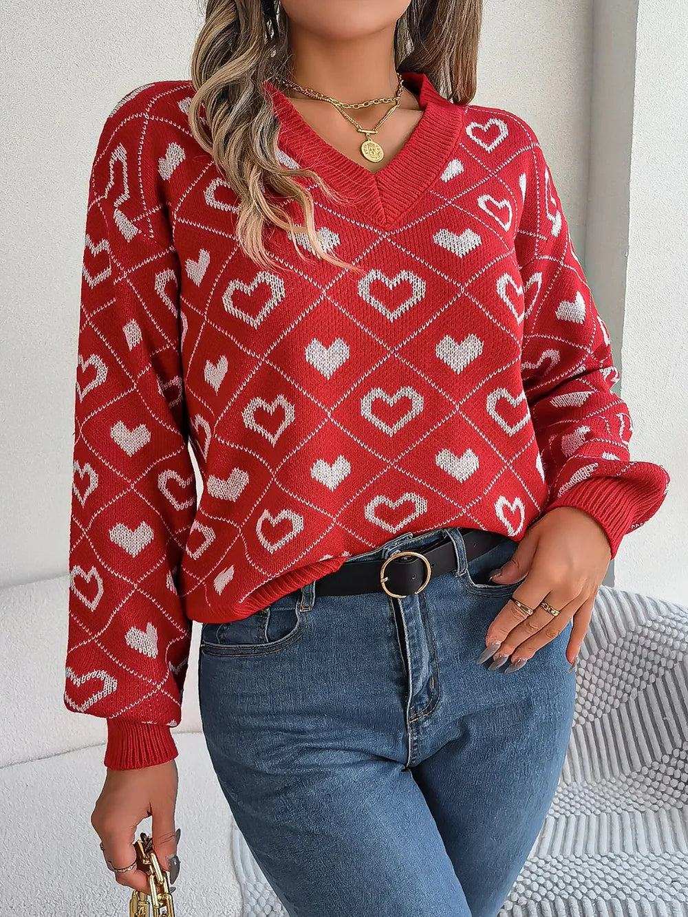 Deep red heart-pattern knit sweater, V-neck, long sleeves, front view