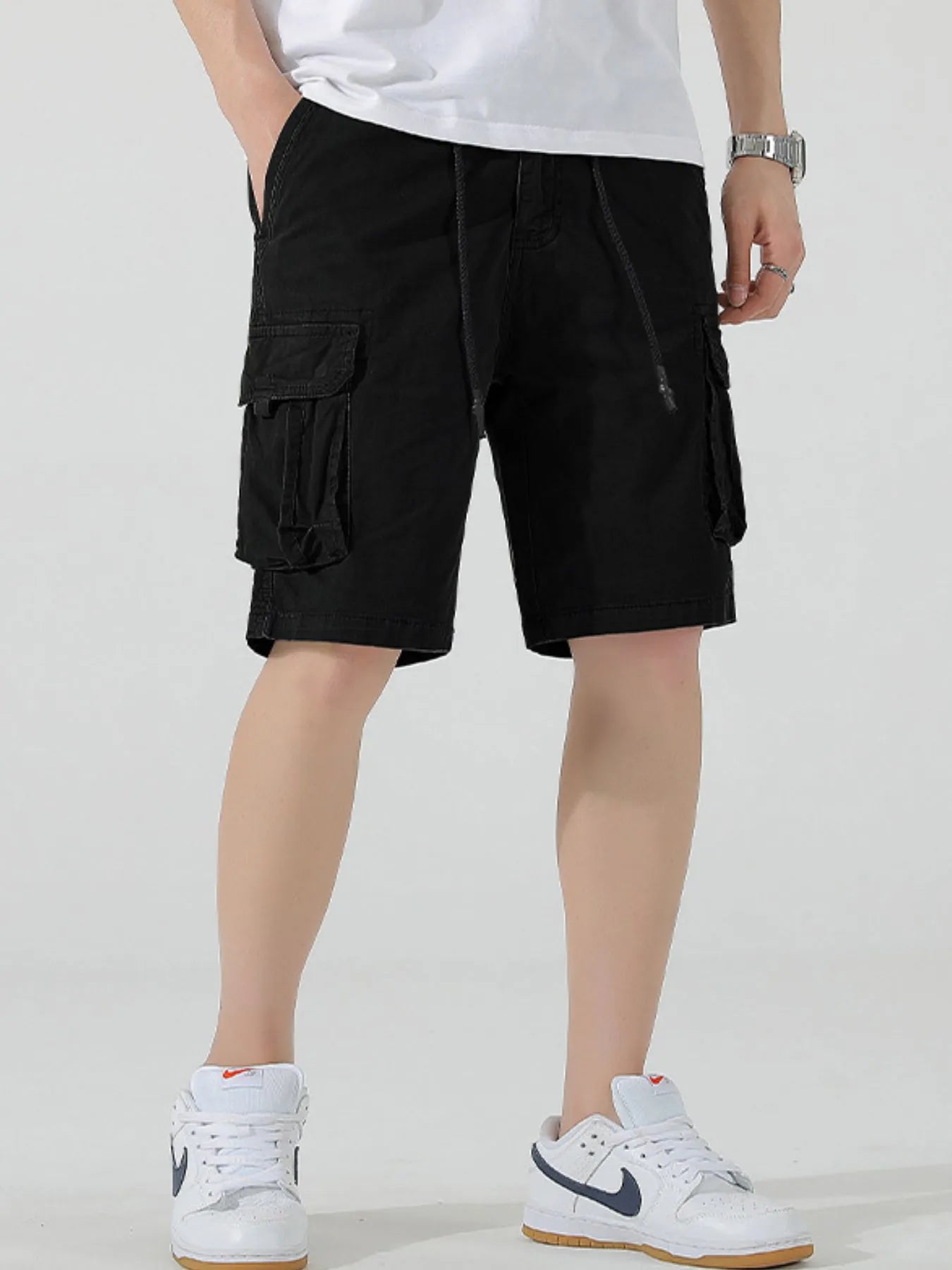 Black drawstring cargo shorts with multiple cargo pockets and drawstring waist