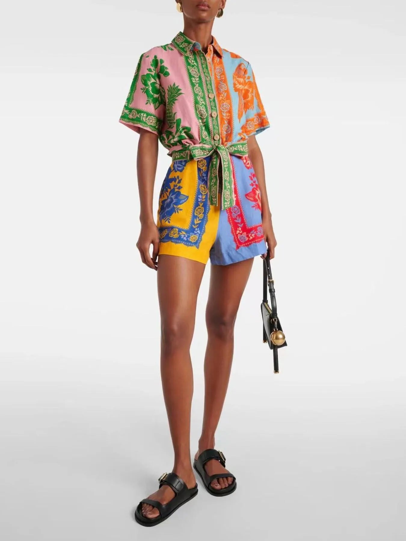 Multicolor printed short romper with tie belt, collared neckline, and front buttons