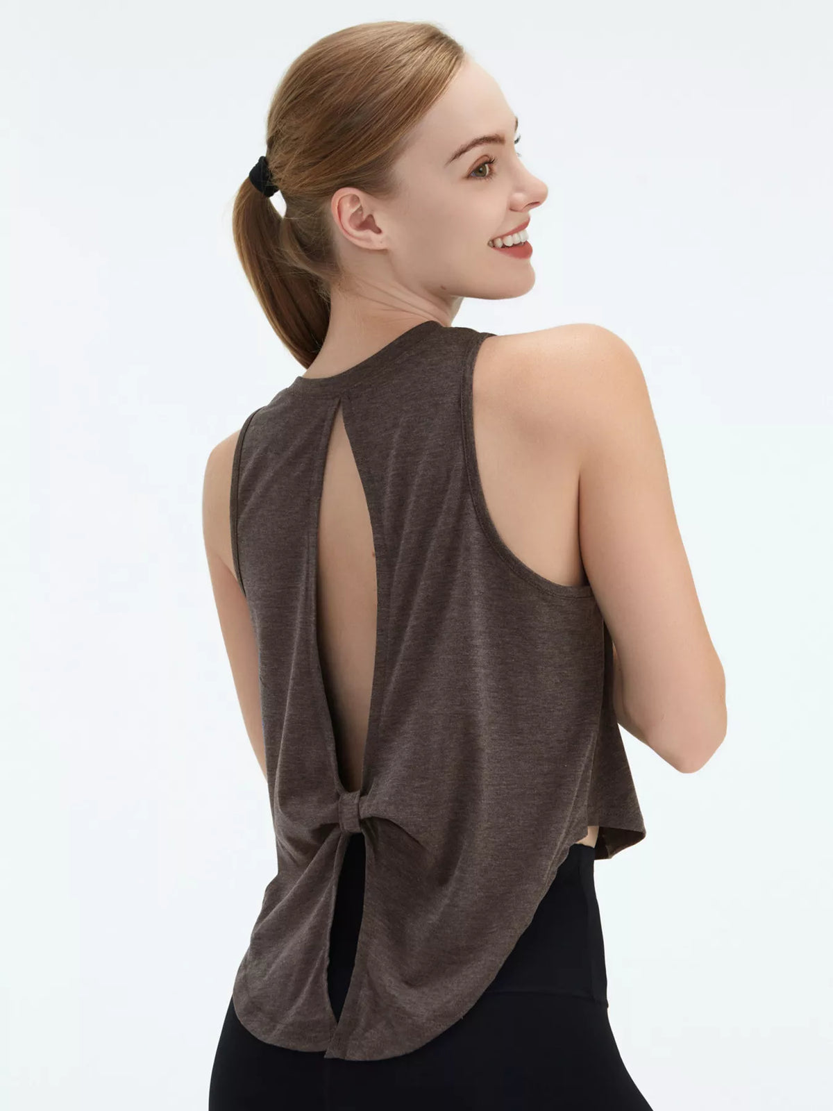 Dark gray active stretch tank top with open cutout back and fabric tie detail
