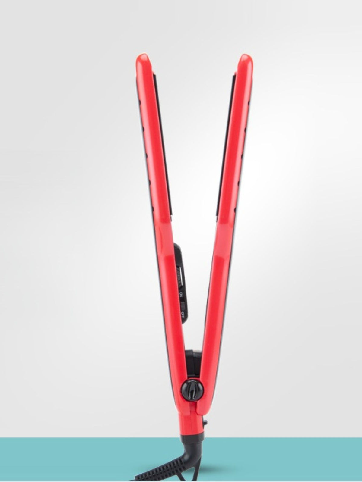 Red hair straightener with black plates, hinged design and corded plug connection.