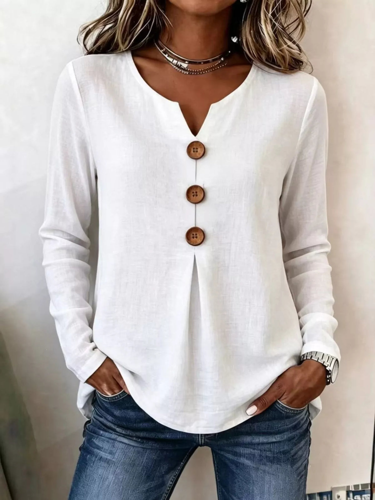White long sleeve blouse with V-neck and decorative center button placket
