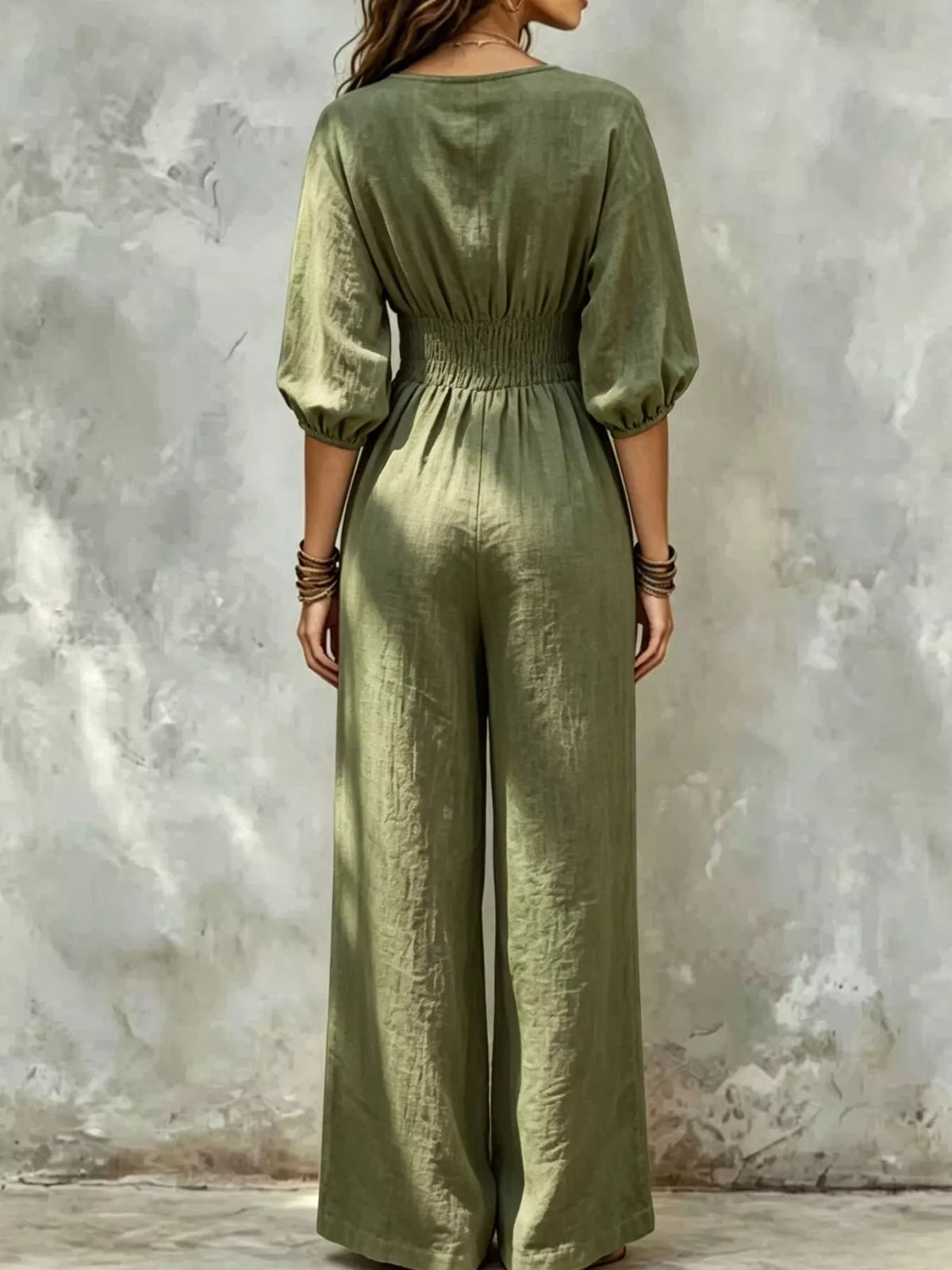 Army green v-neck smocked-waist wide-leg jumpsuit, back view