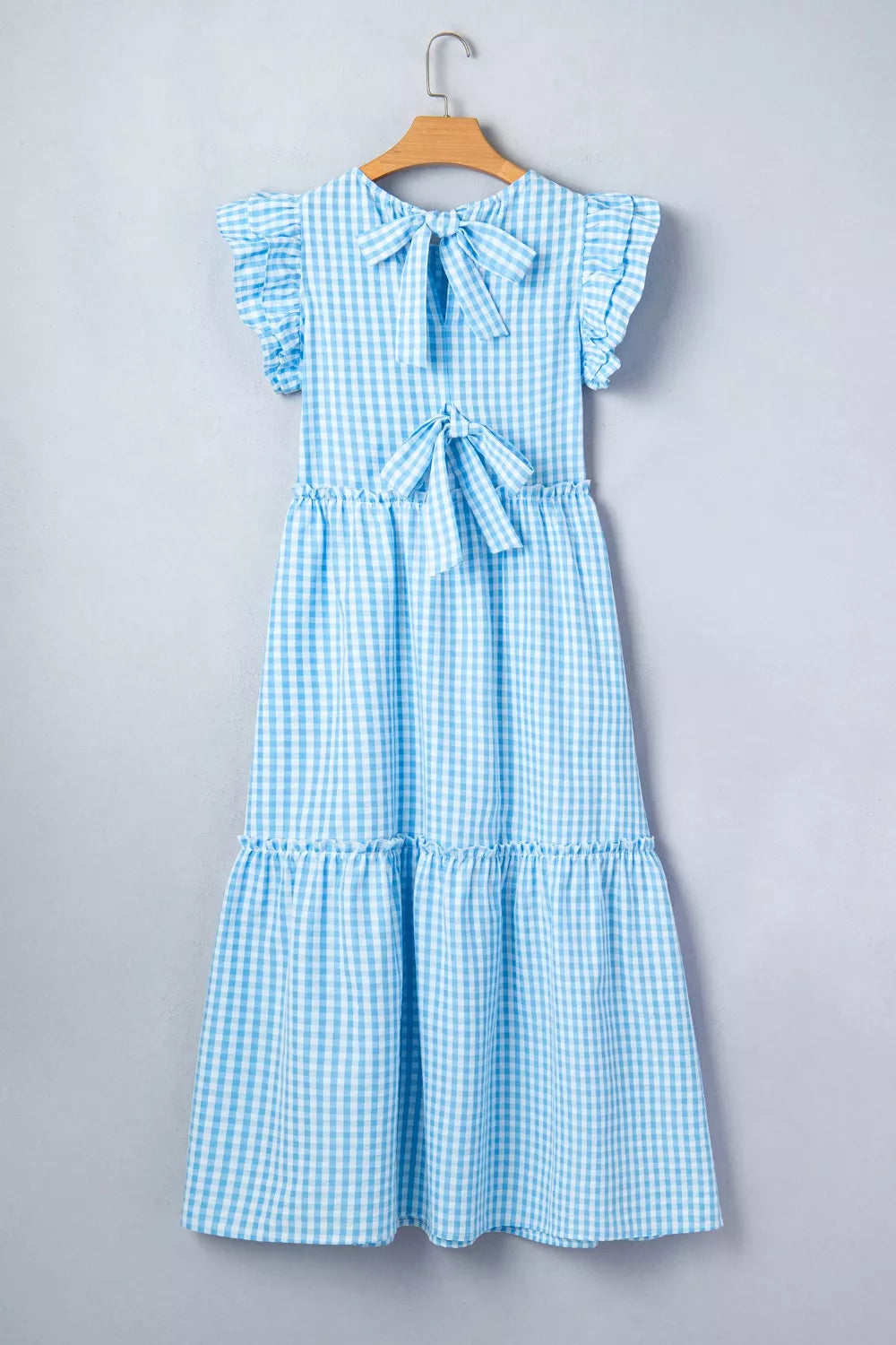 Cedar & Moore Knot Back Ruffled Short Sleeve Gingham Maxi Dress in blue gingham with back bow and tiered skirt