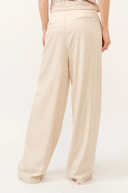 High-rise wide-leg linen-blend pants in oatmeal, back view with smooth waistband
