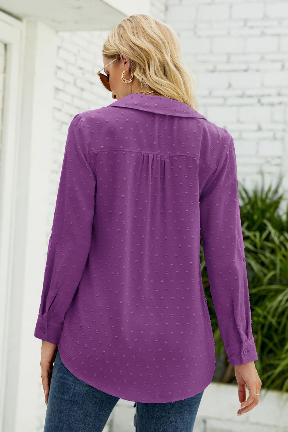 Purple swiss dot blouse, back view, long sleeves and loose buttonless fit