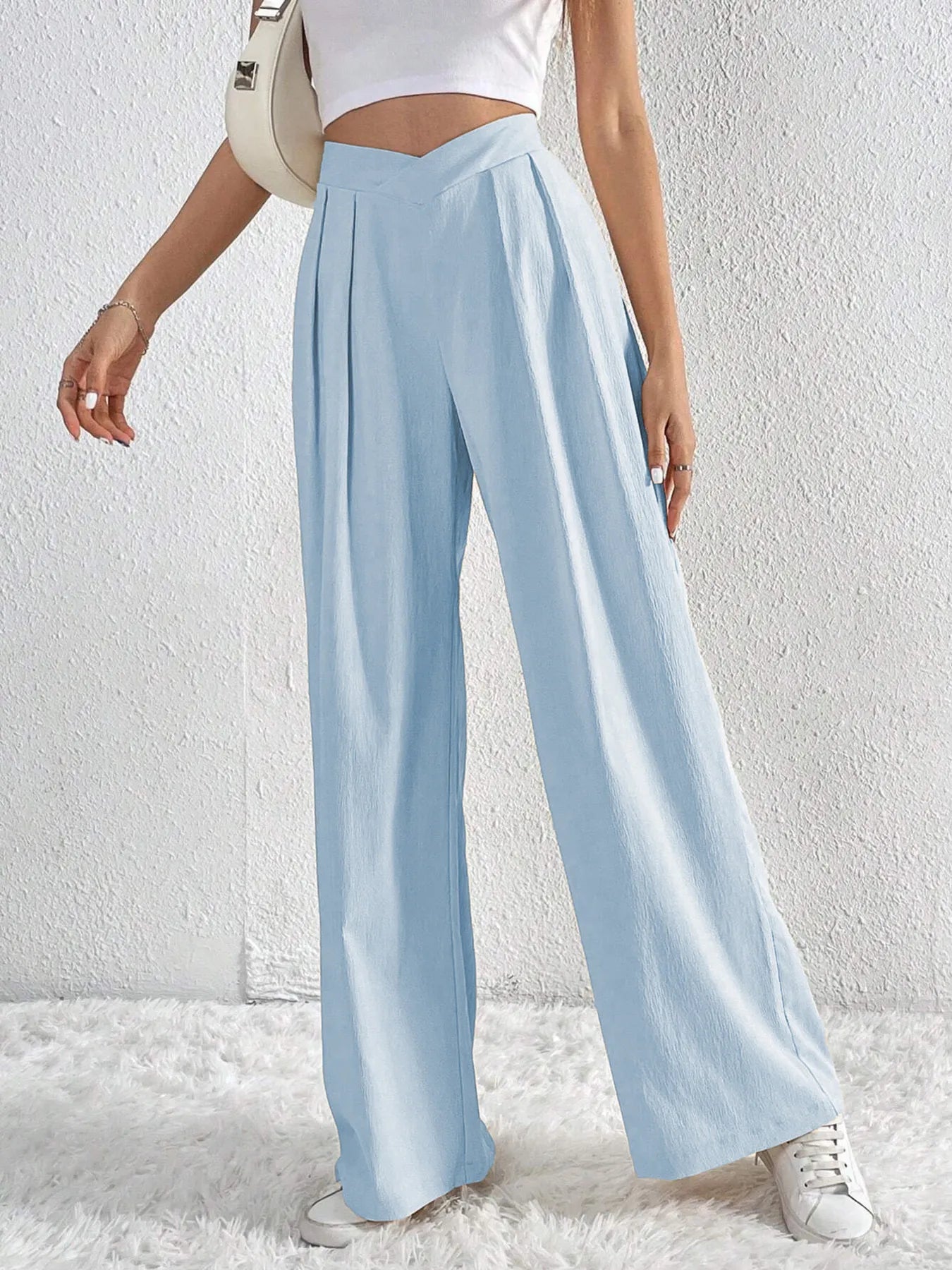Light blue wide-leg trousers with gathered V-waist and loose flowing legs
