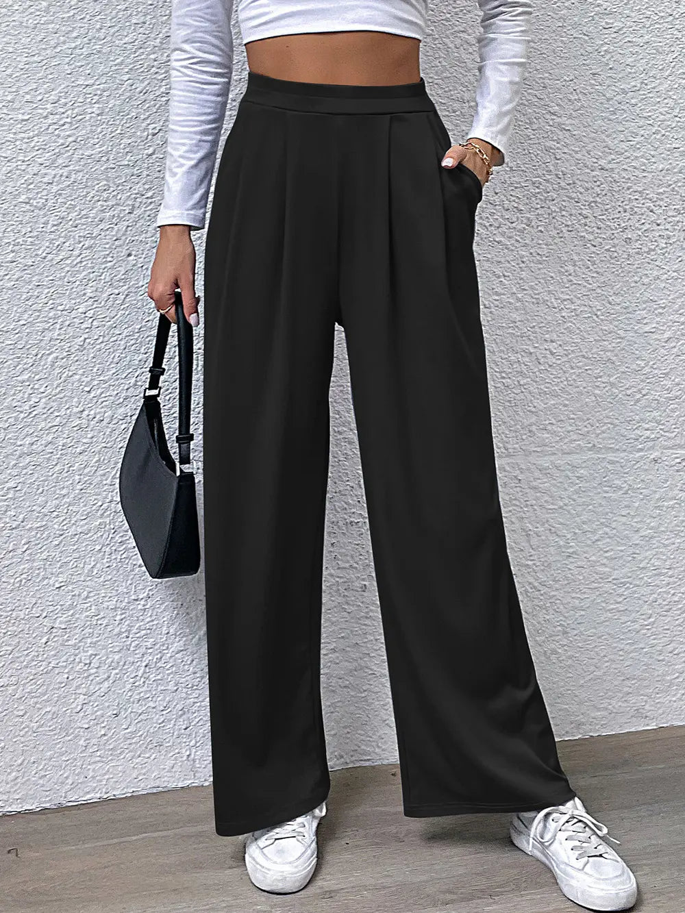 High-waist straight black pants with pleated front and wide legs