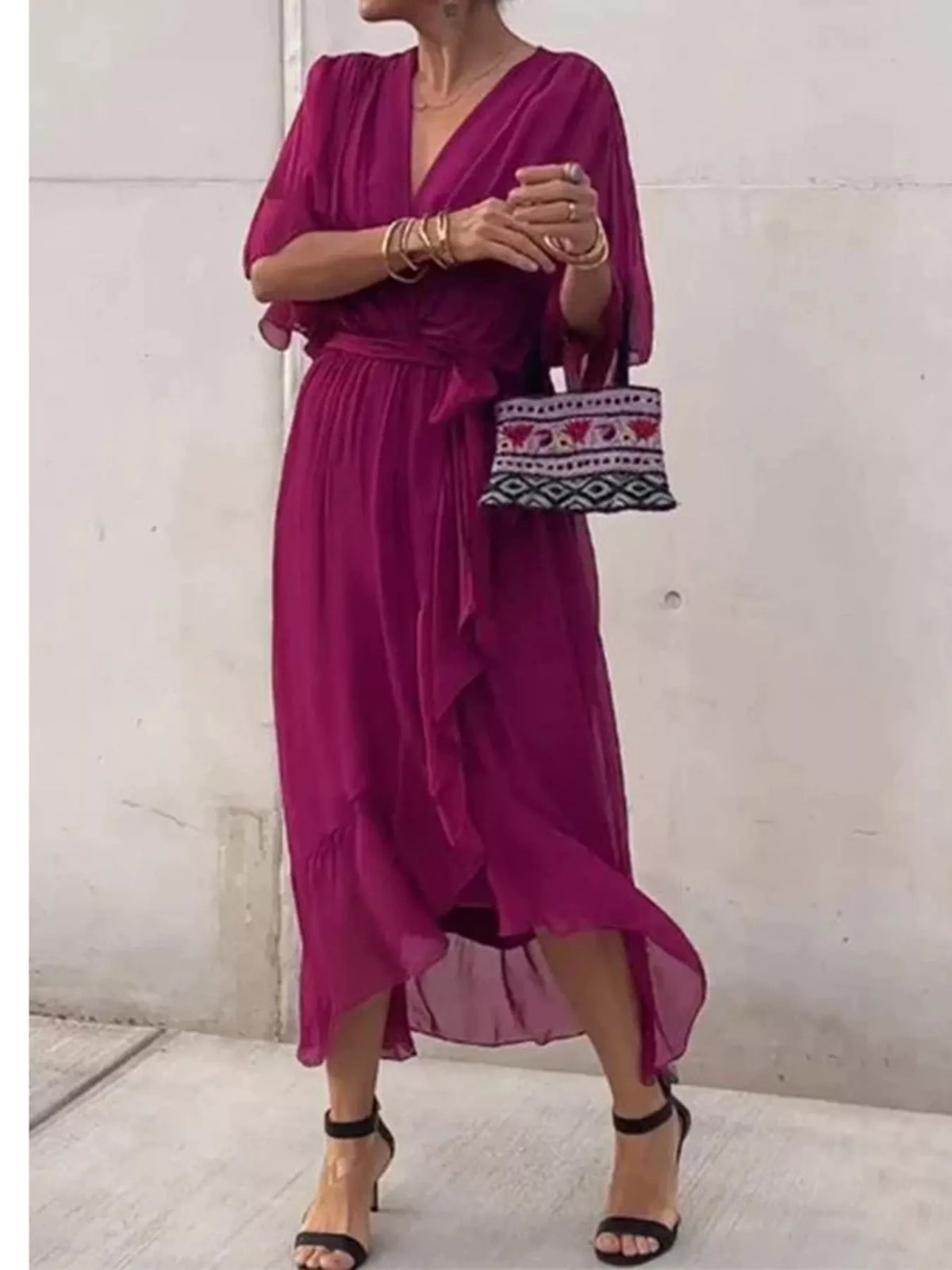 Magenta wrap dress with ruched batwing sleeves and waist tie, knee-length chiffon hem
