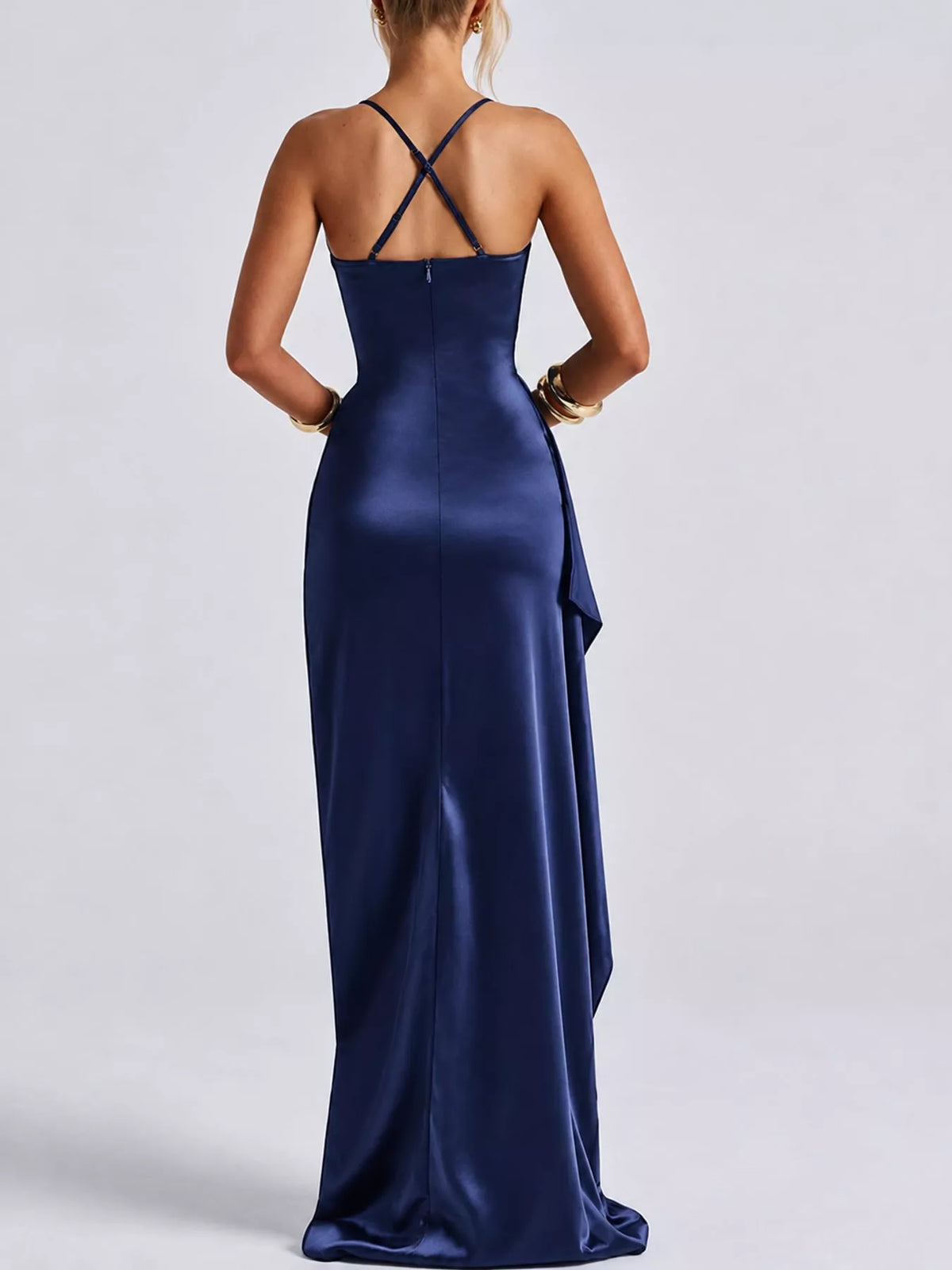 Dark blue satin maxi dress with crisscross open-back straps and high side slit.