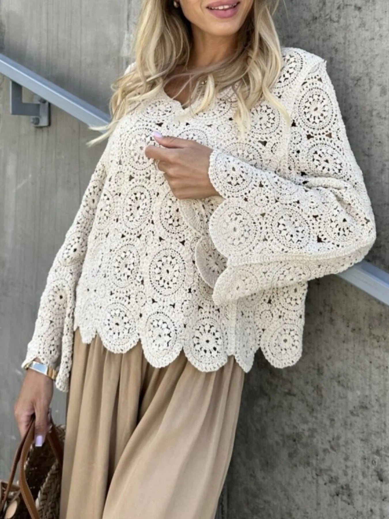 White crochet lace V-neck knit top with long bell sleeves and scalloped trim