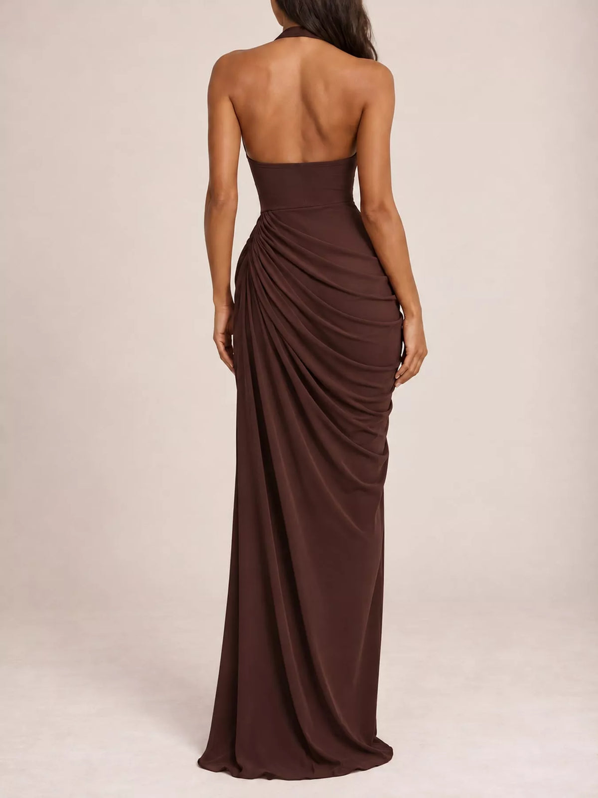 Back view of brown halter neck maxi dress with ruched drape and high slit