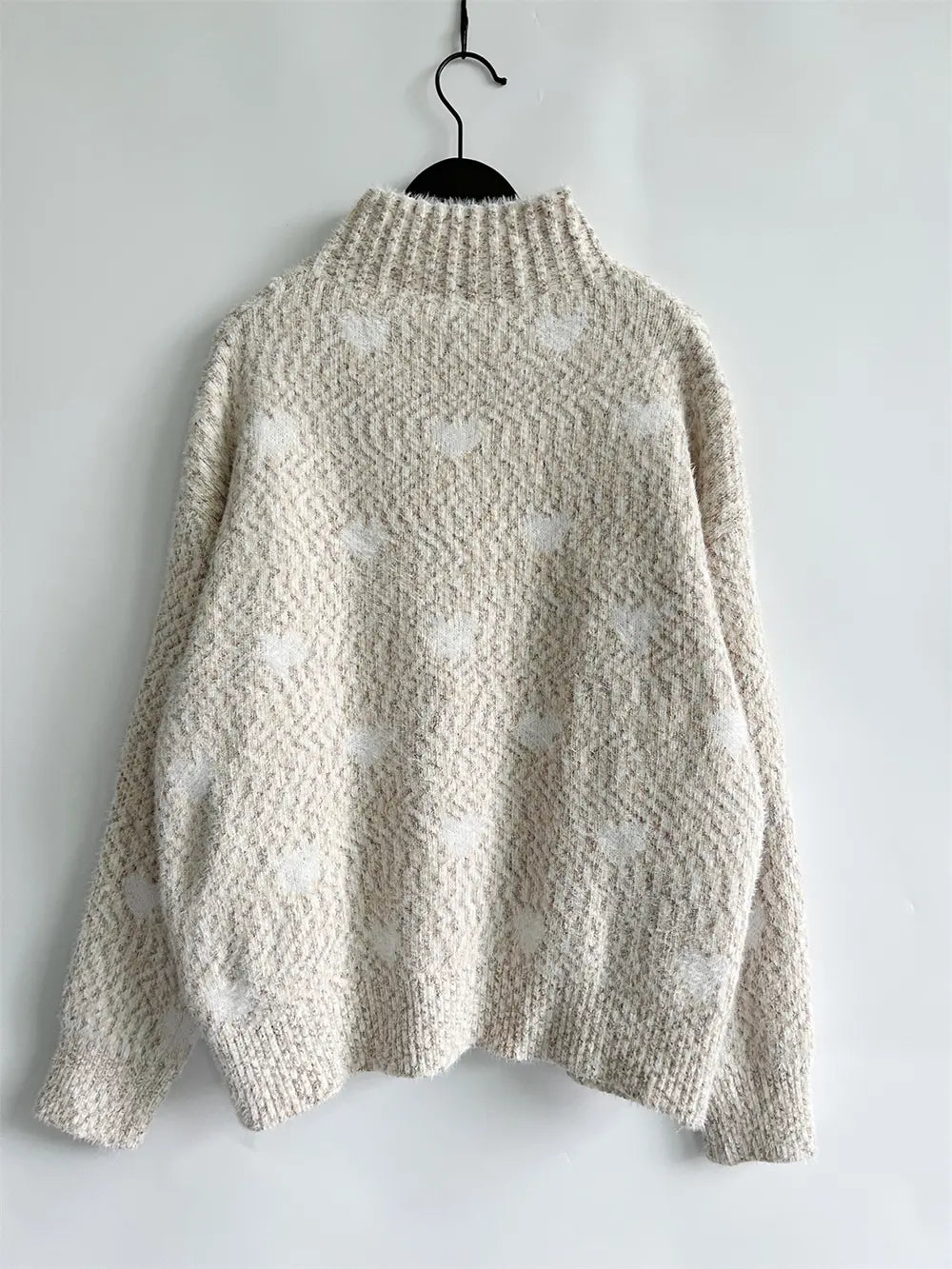 Light heathered knit turtleneck sweater with drop shoulders and ribbed neckline