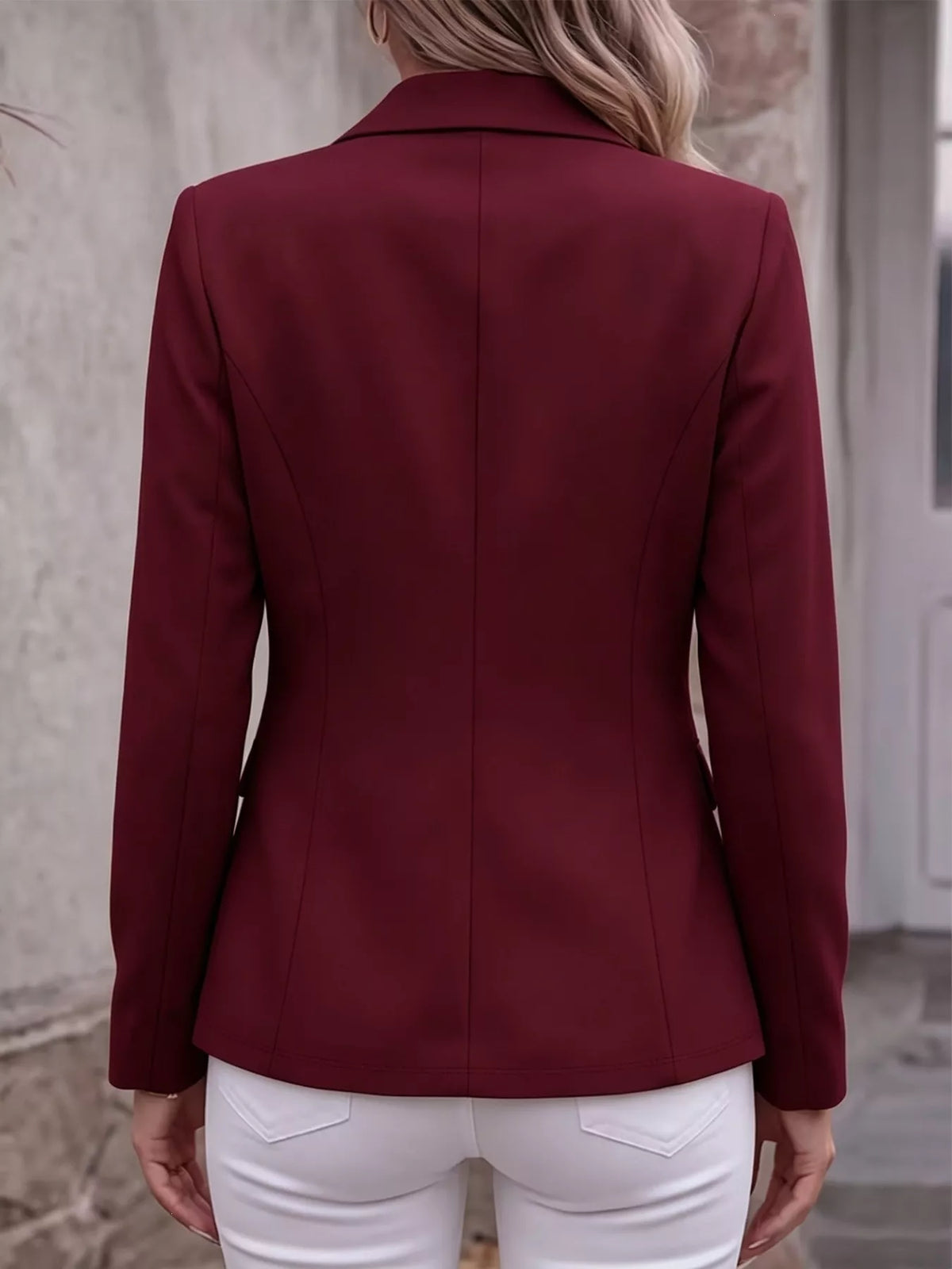 Back view of wine red lapel long-sleeve blazer with structured seams
