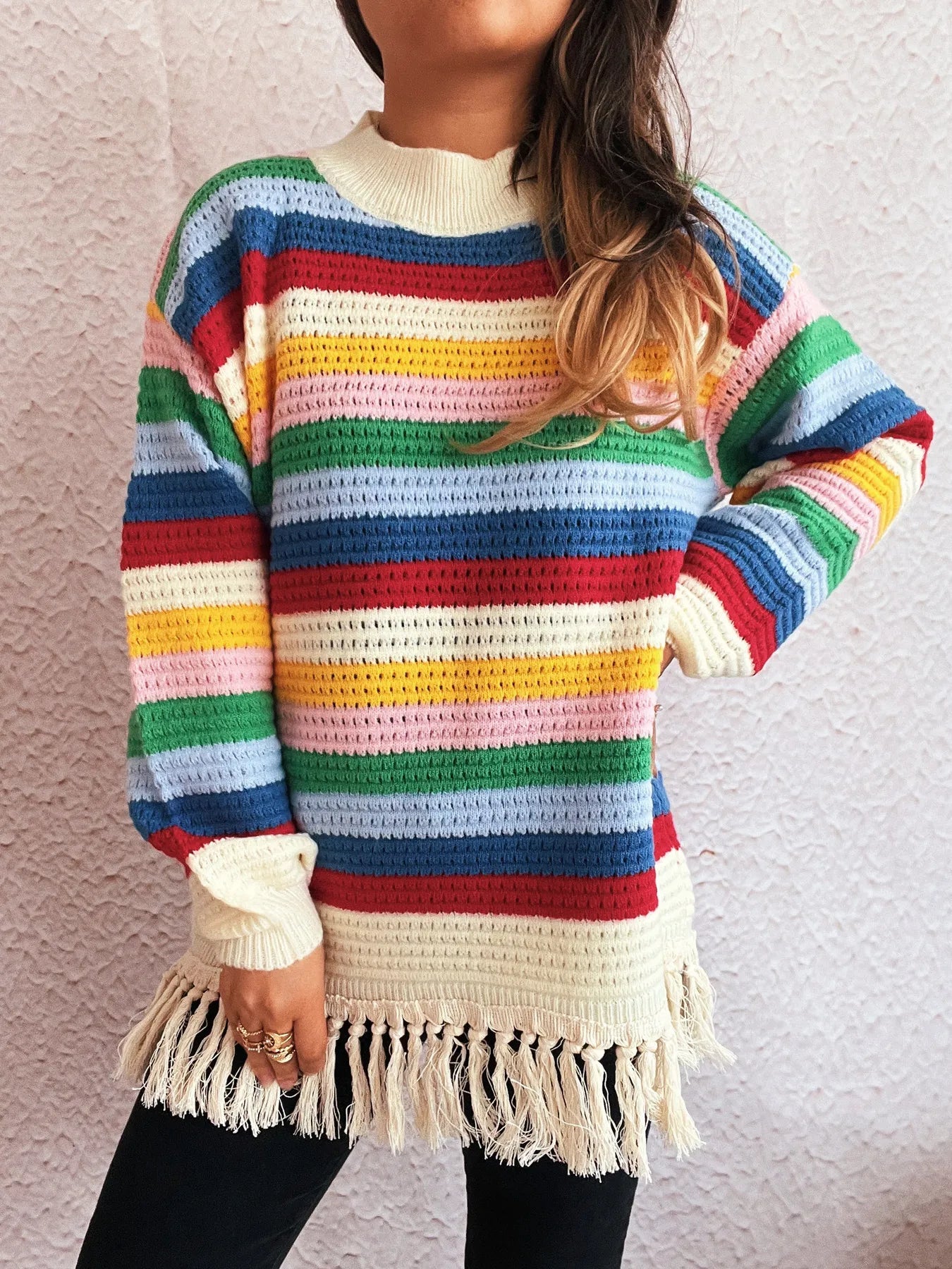 Rainbow striped long sleeve sweater with cream collar and tassel fringe hem