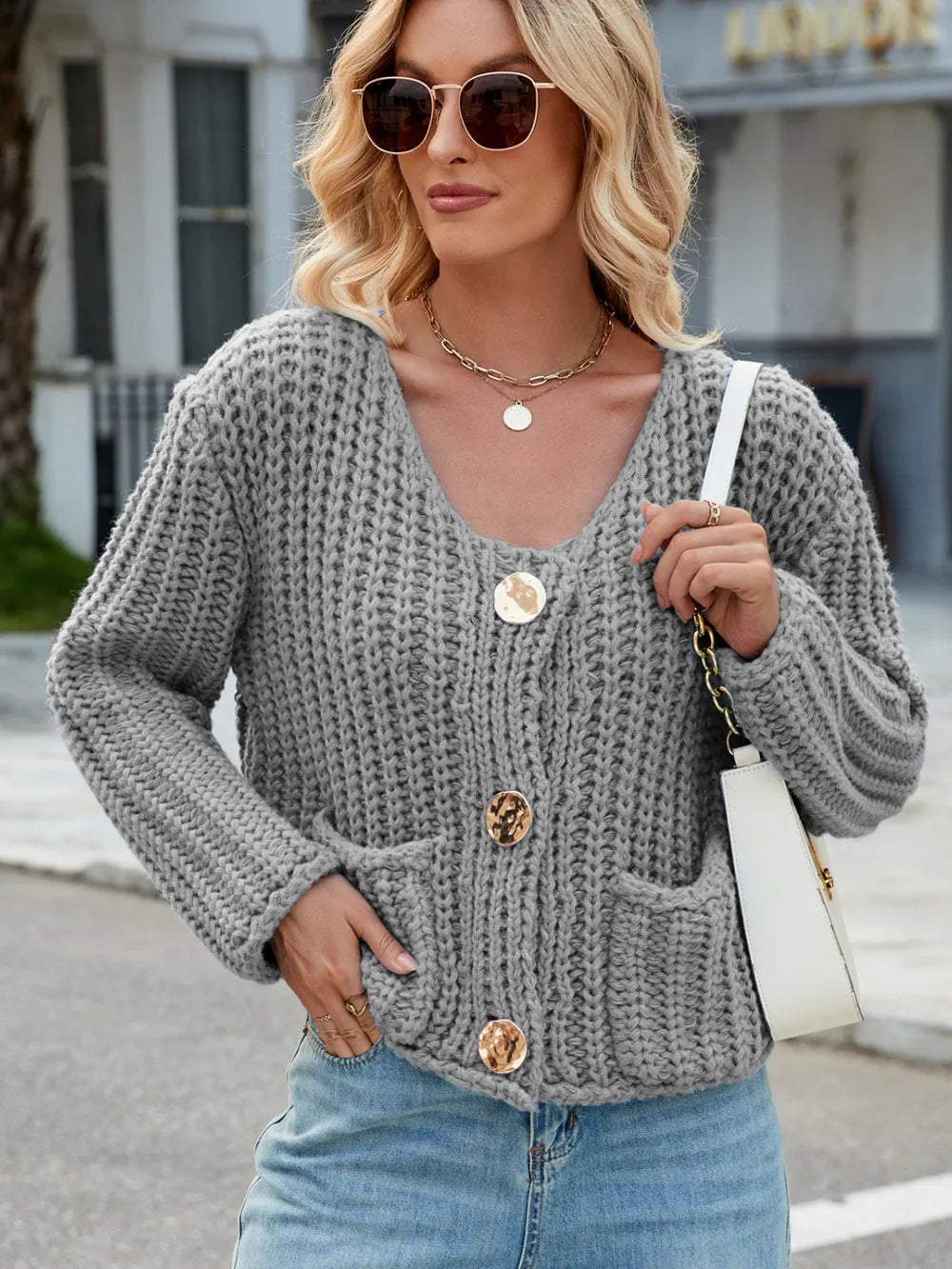 Gray round-neck button cardigan with long sleeves and front patch pockets