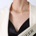 Gold-plated necklace with small freshwater pearls in a curved drop pattern