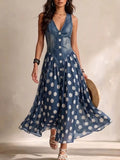 Blue polka dot sleeveless V-neck maxi dress with button front and flared skirt