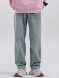 Light blue wide-leg distressed wash cotton jeans, ripped knee