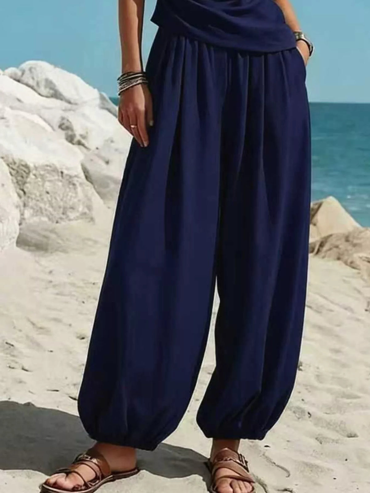 Navy one-shoulder sleeveless top with pleated harem pants
