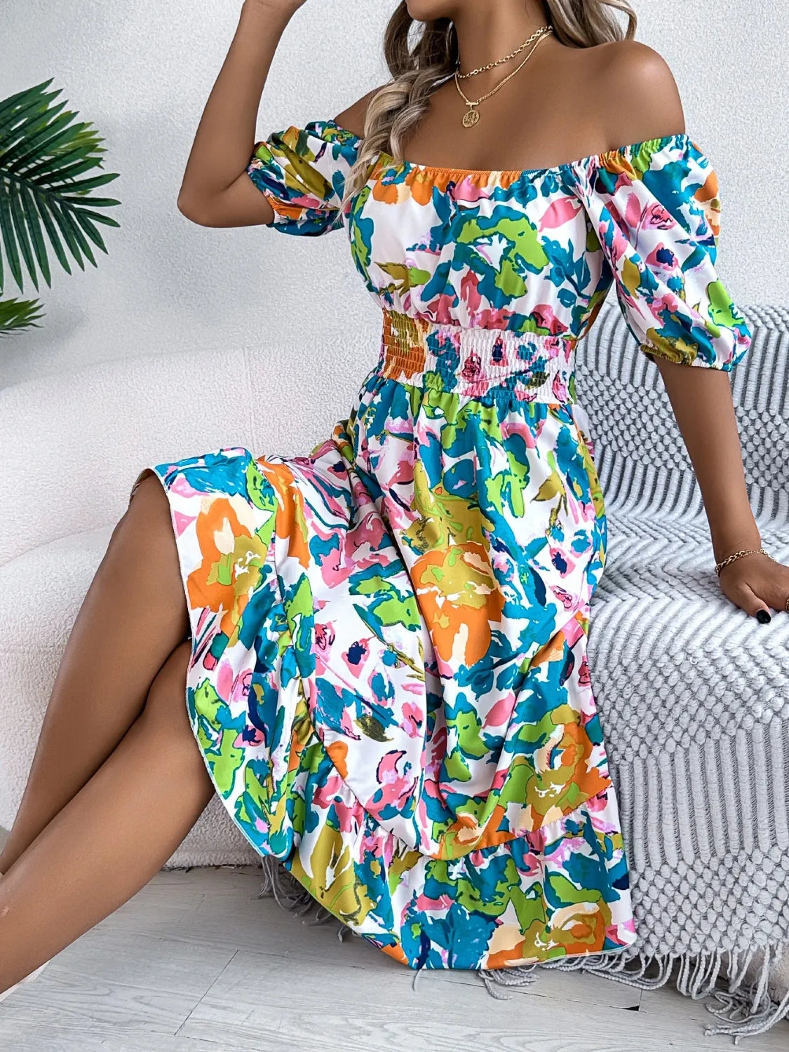 Off-shoulder smocked floral midi dress with multicolor print, flared ruffle hem